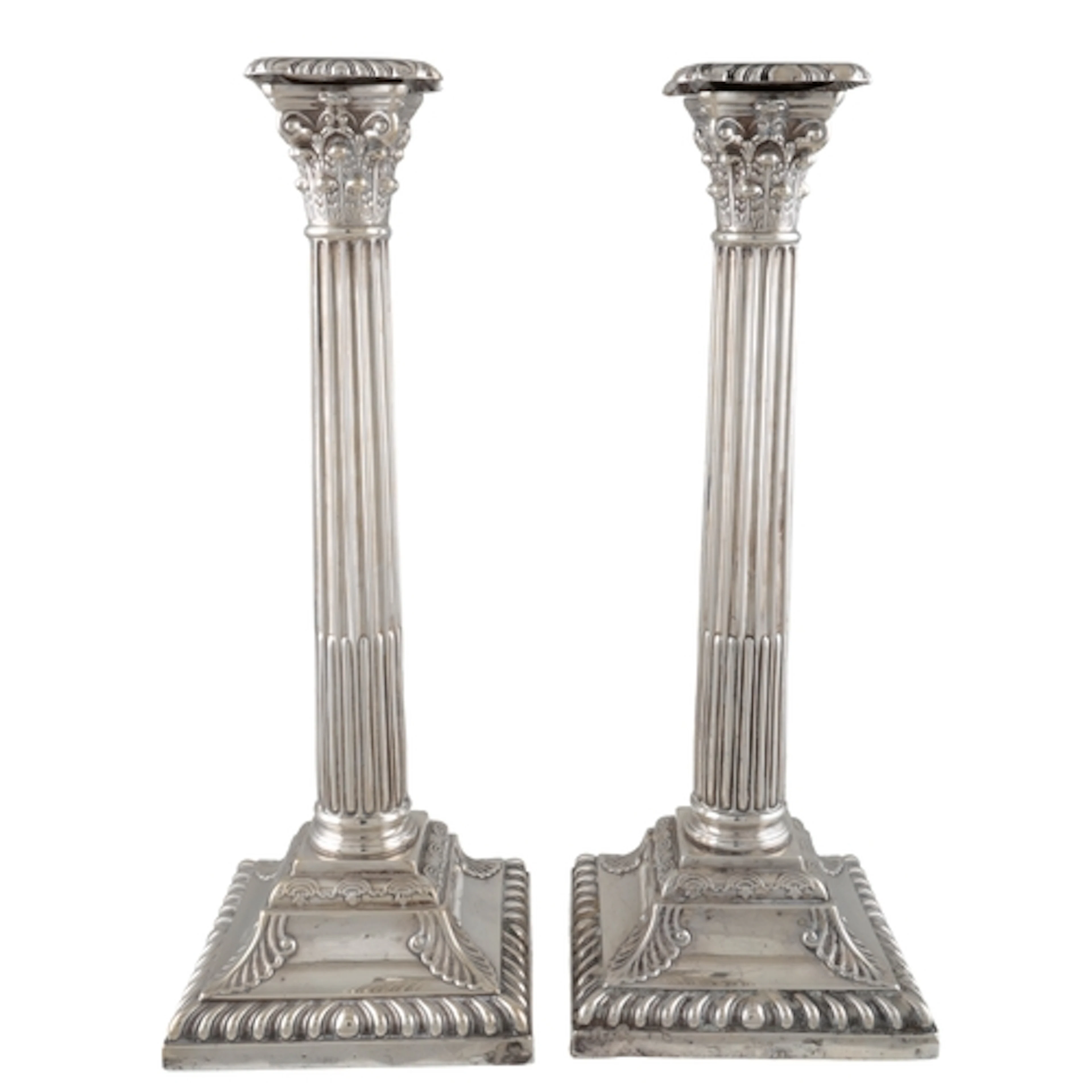A pair of Victorian silver Corinthian column candlesticks, b...