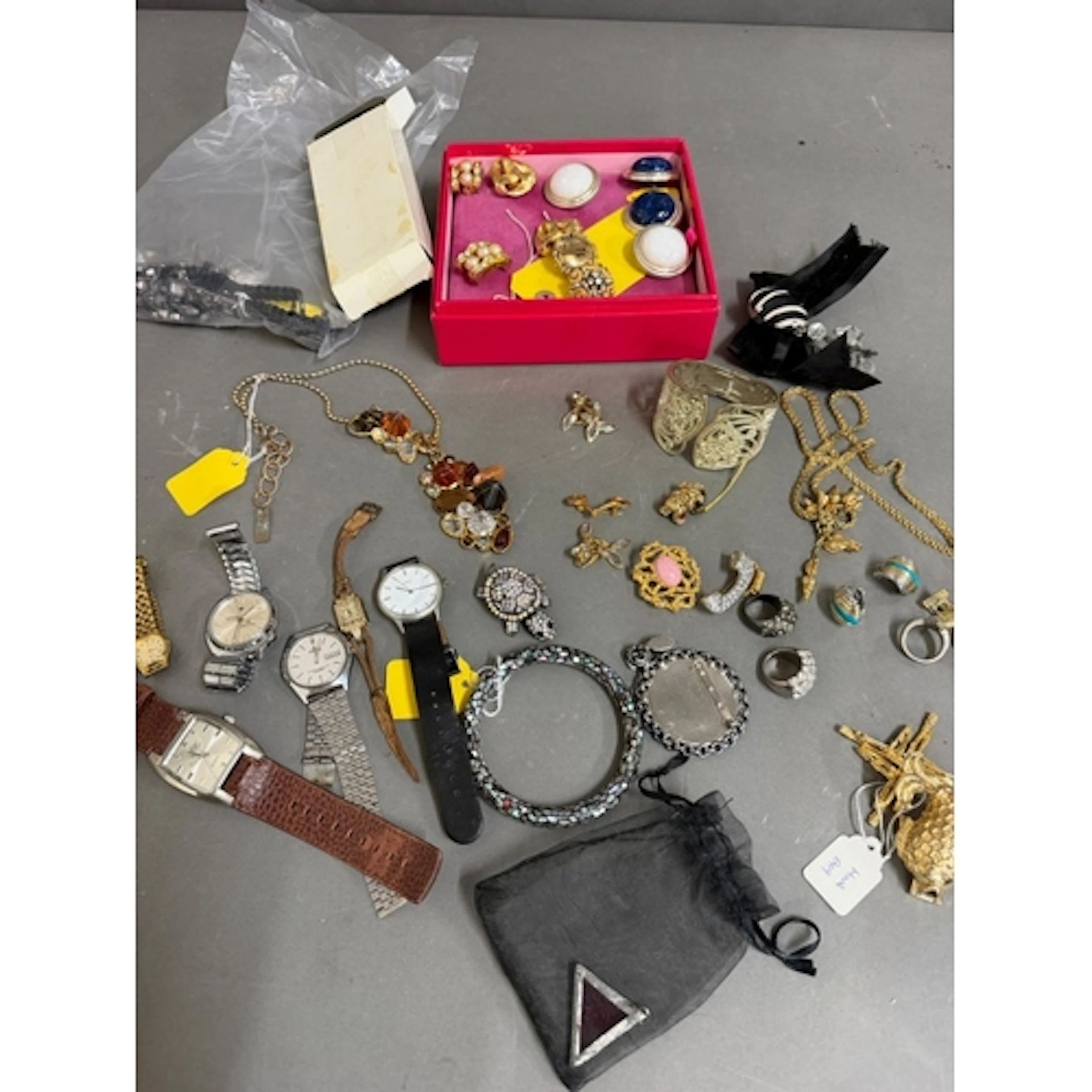 A selection of costume jewellery, including watches