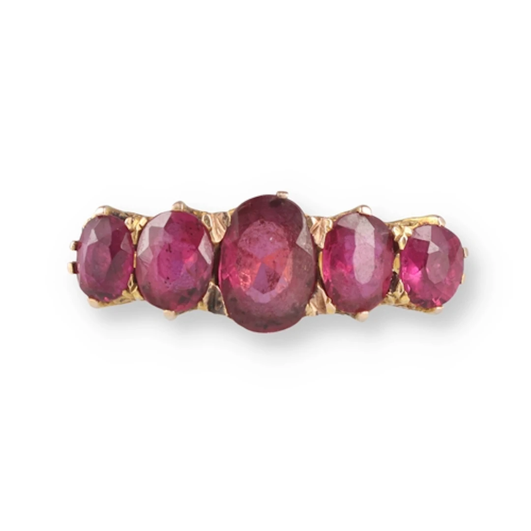 AN ANTIQUE FIVE STONE RUBY RING The five graduated rubies mo...