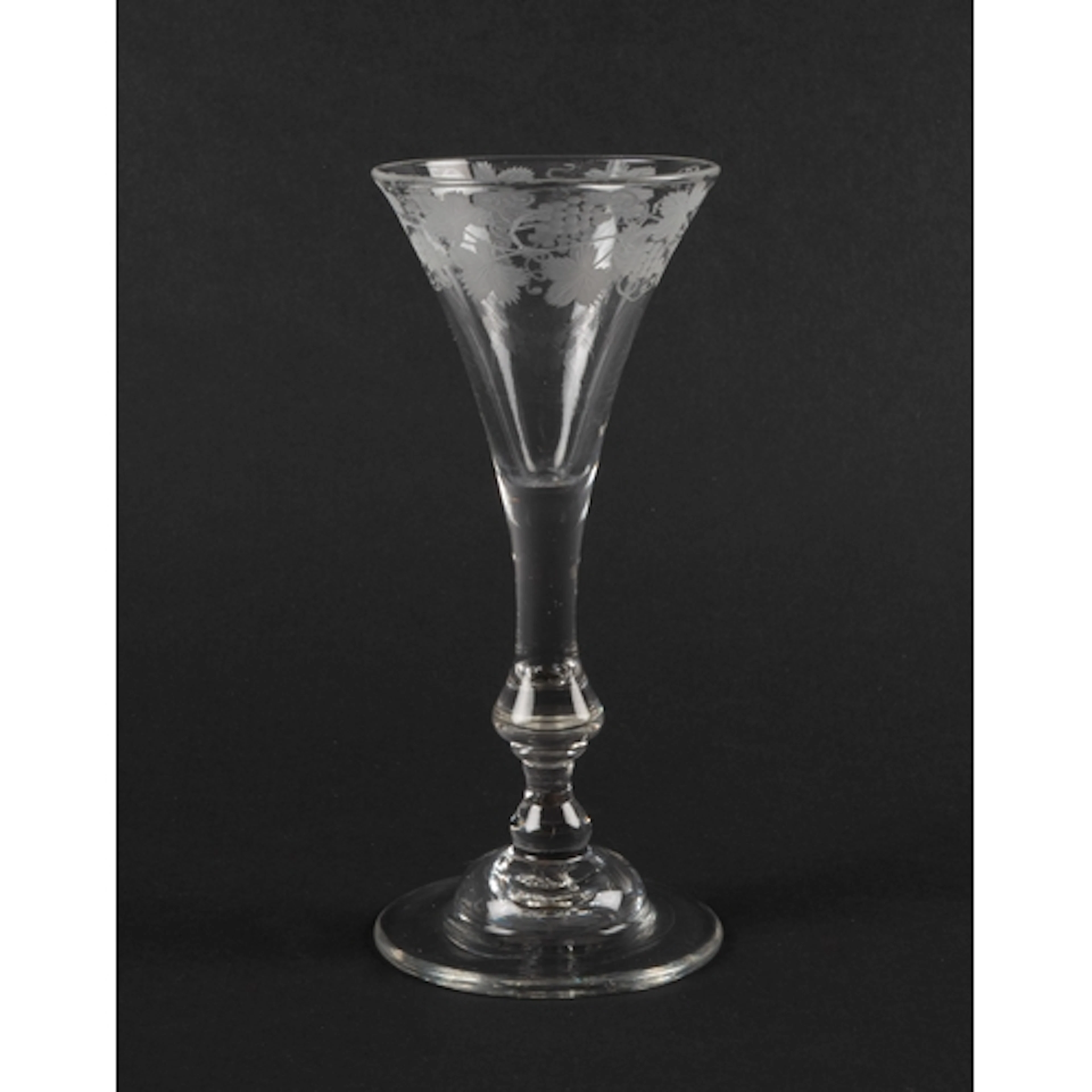 A balustroid wine glass of Kit Kat type, c.1740, the drawn t...