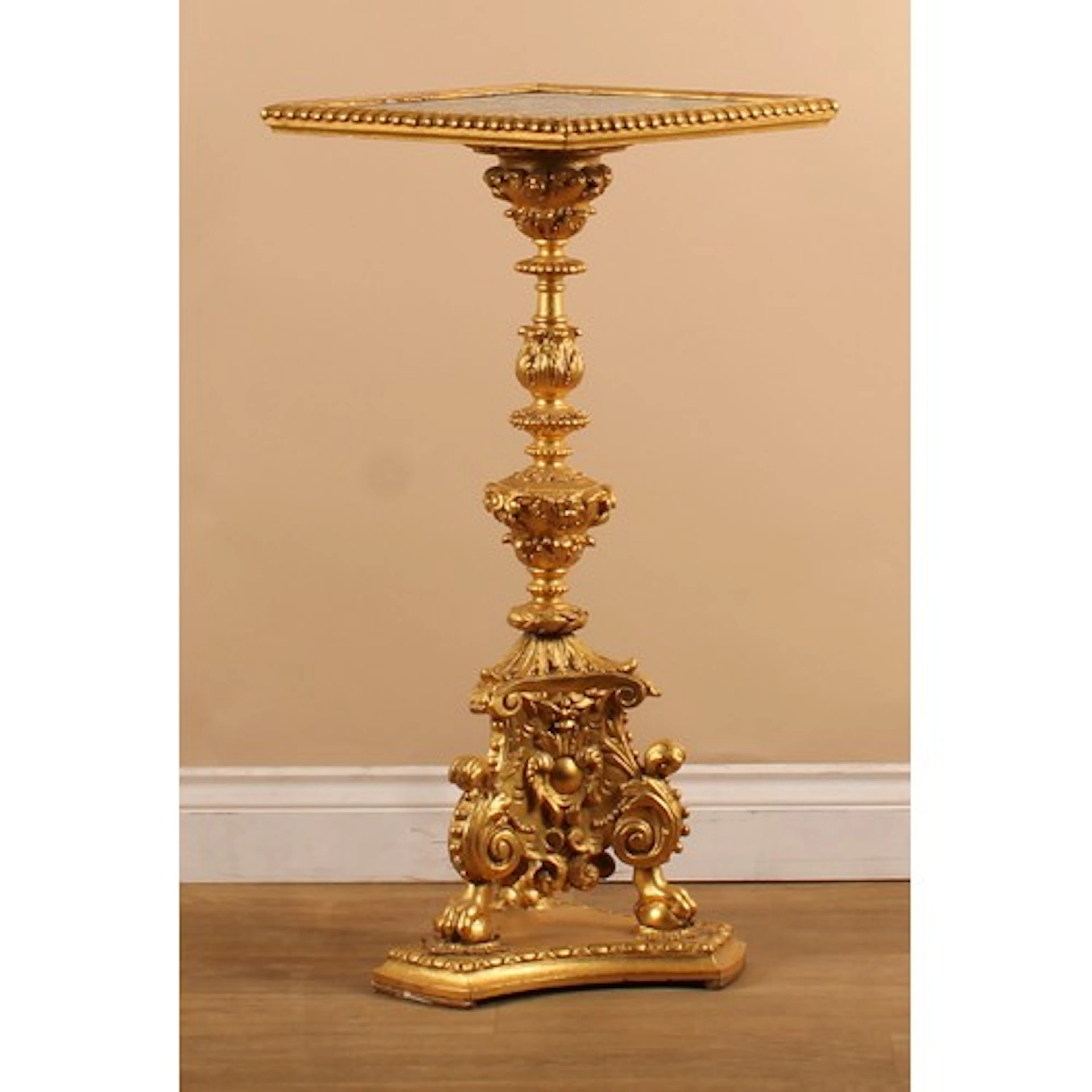 A 19th century giltwood pedestal lamp table, the top incorpo...