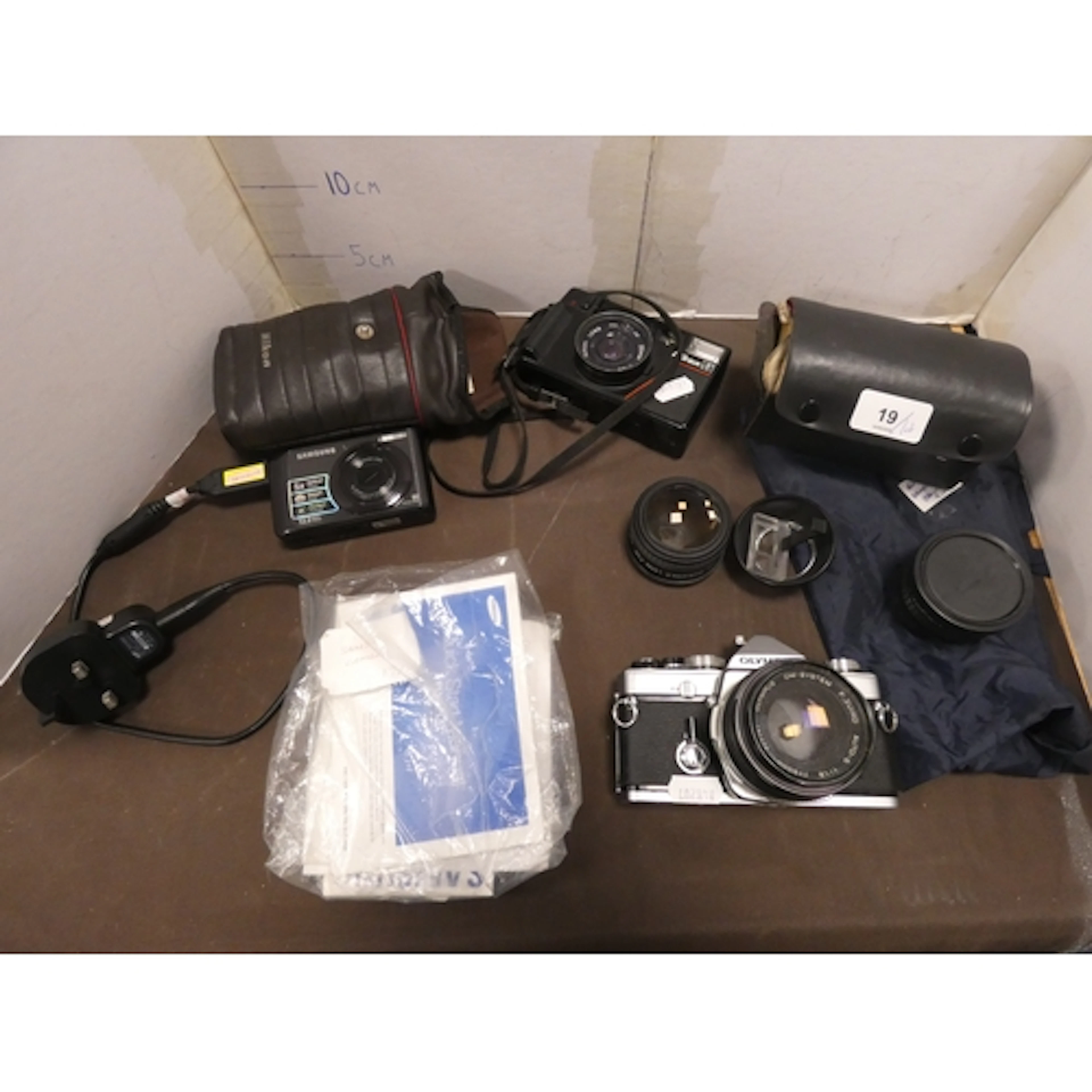 Cameras to include an Olympus OM-1 with accessories, Nikon A...