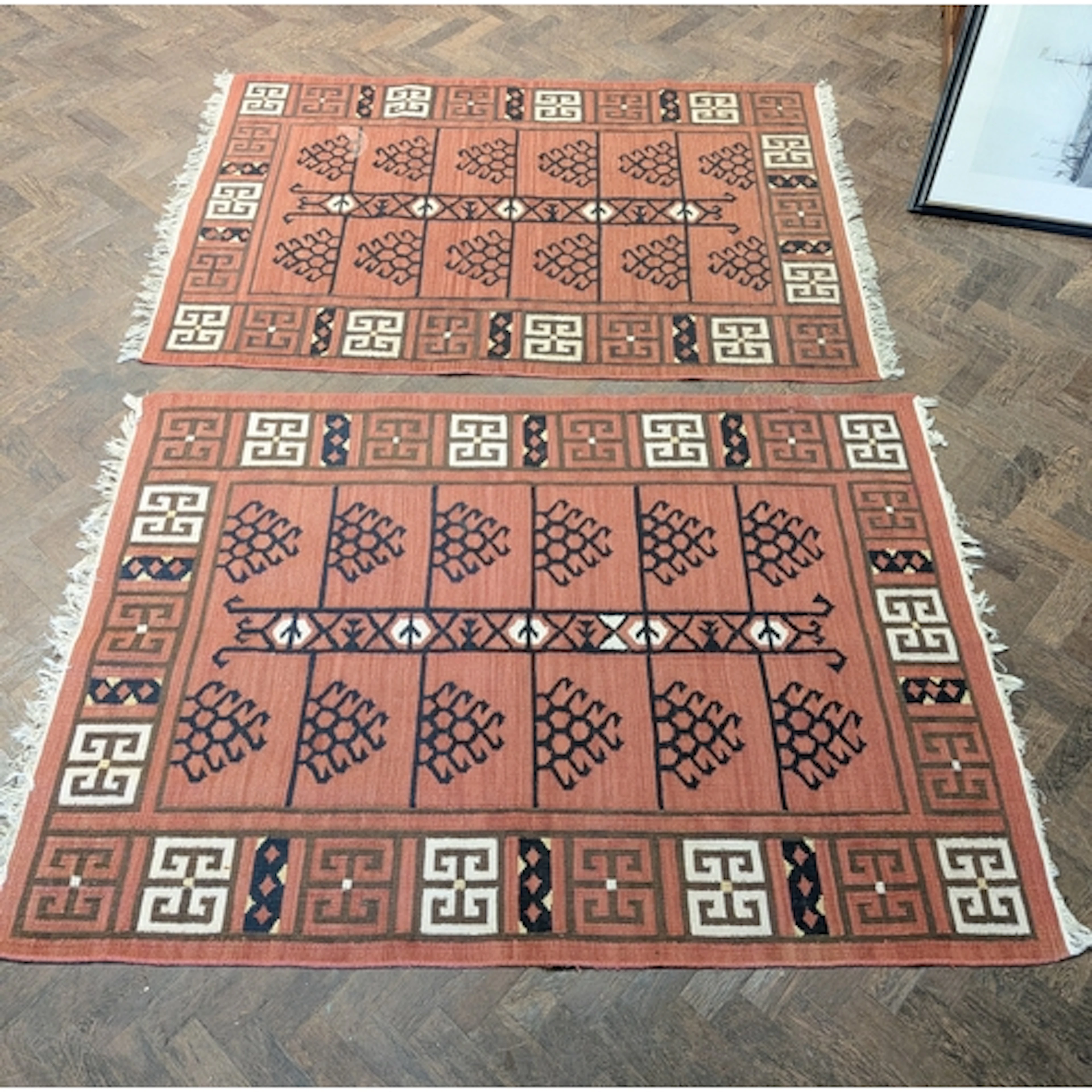 A pair of rust geometric design Kilim rugs, each 6' x 4'3"