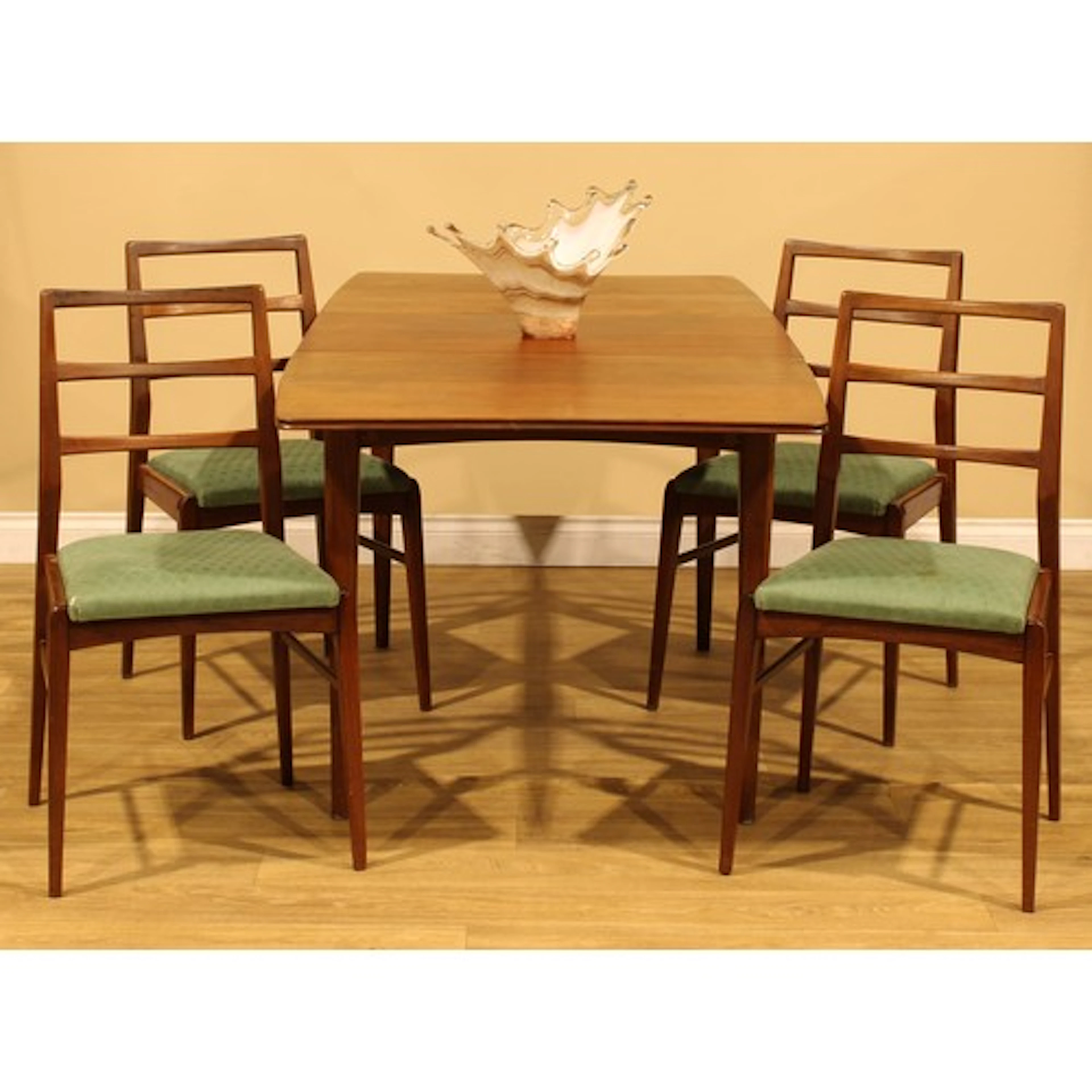 Mid-century Design - an afrormosia extending dining table an...