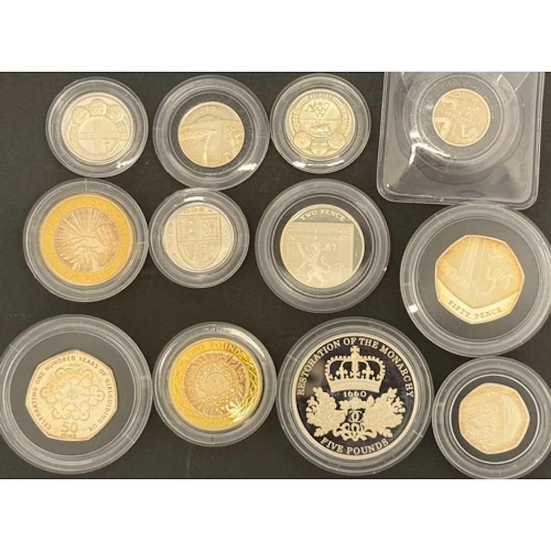 A group of 12 loose UK QEII 2010 silver proof coins from the...