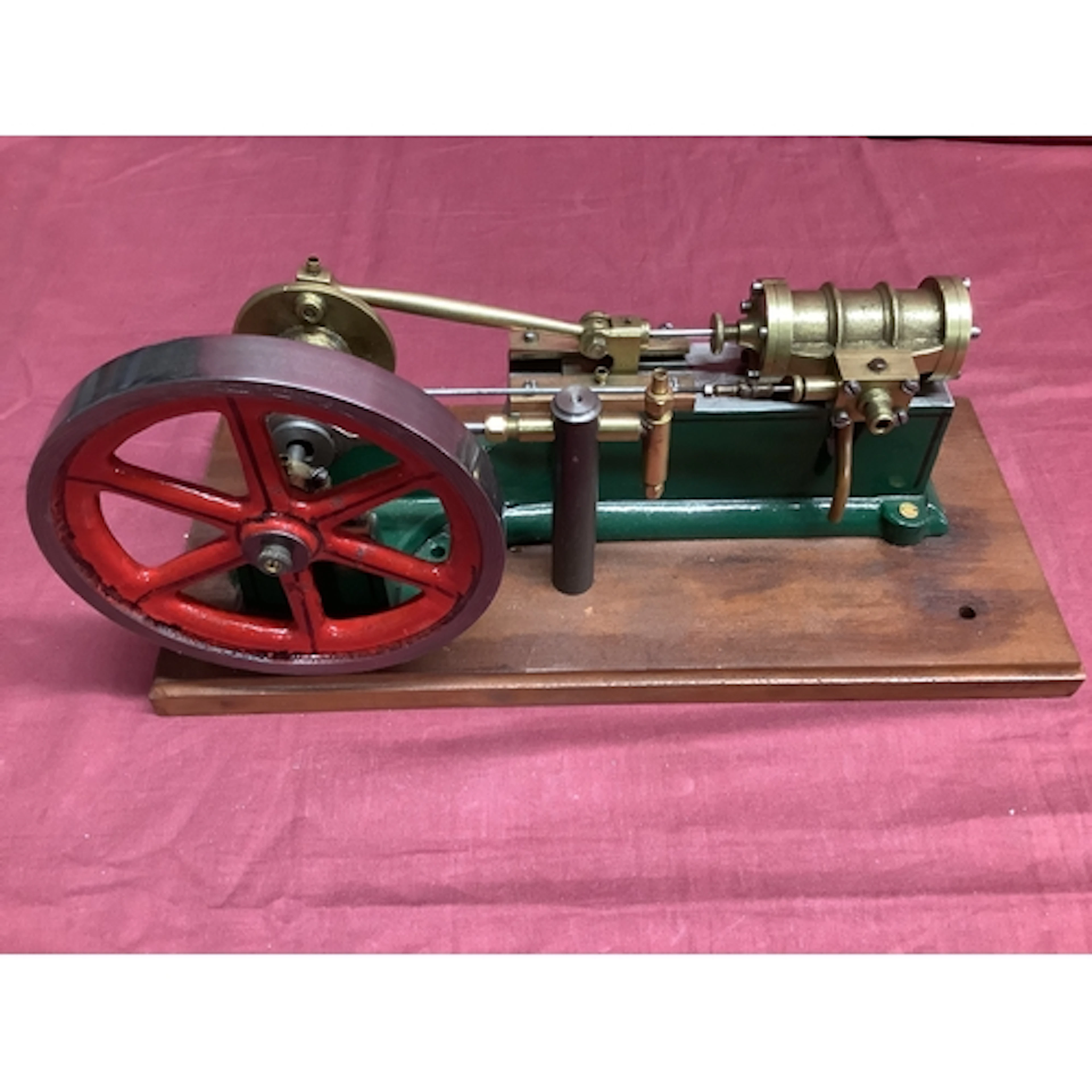 A Horizontal Ex Mill Working Live Steam Engine with Water Pu...