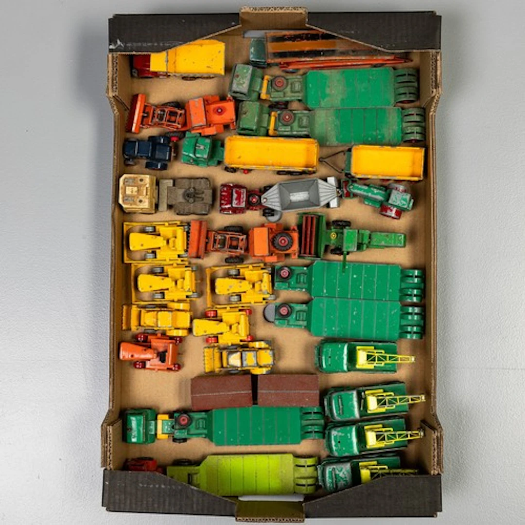 Fruit trat containing selection of playworn unboxed Matchbox...