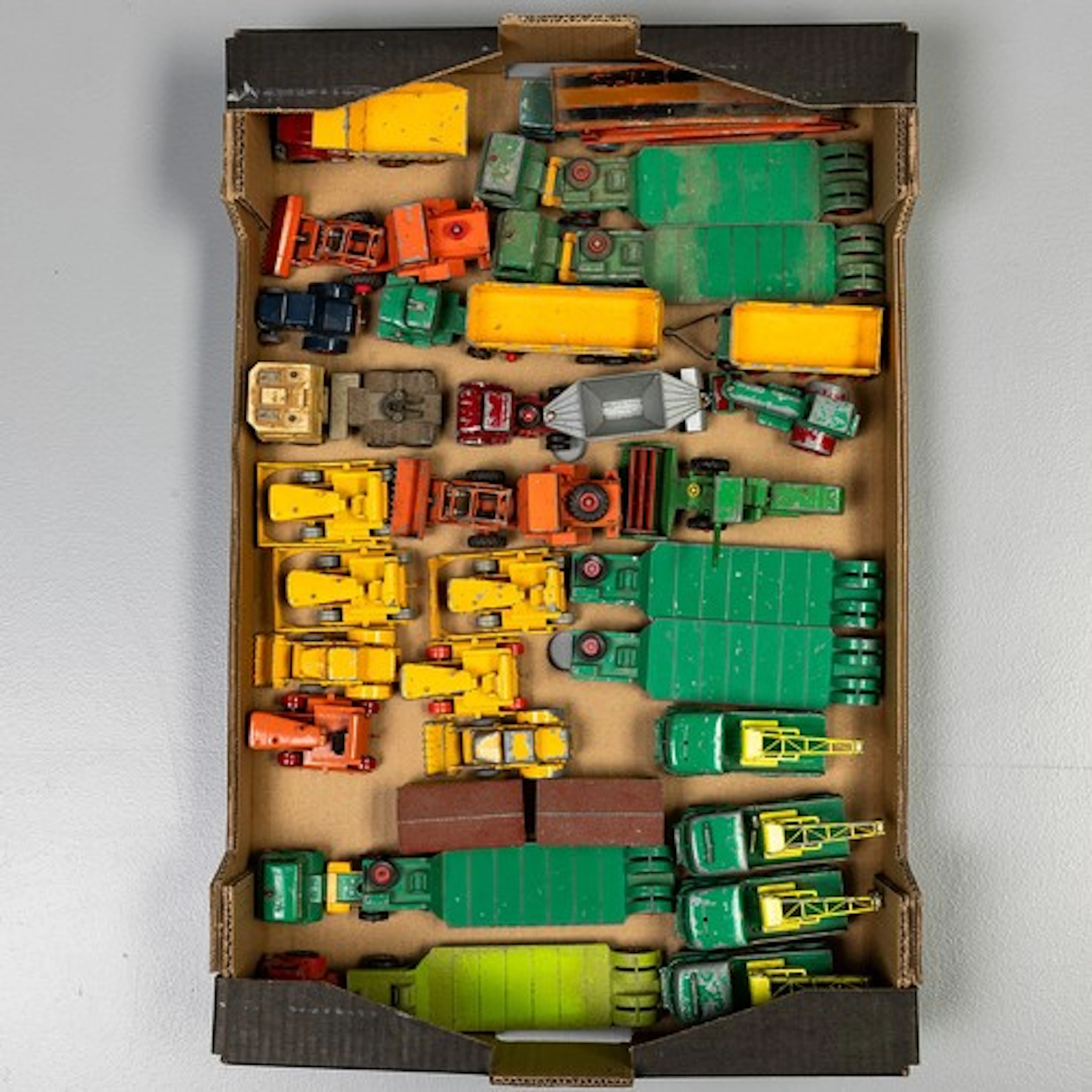 Fruit trat containing selection of playworn unboxed Matchbox...