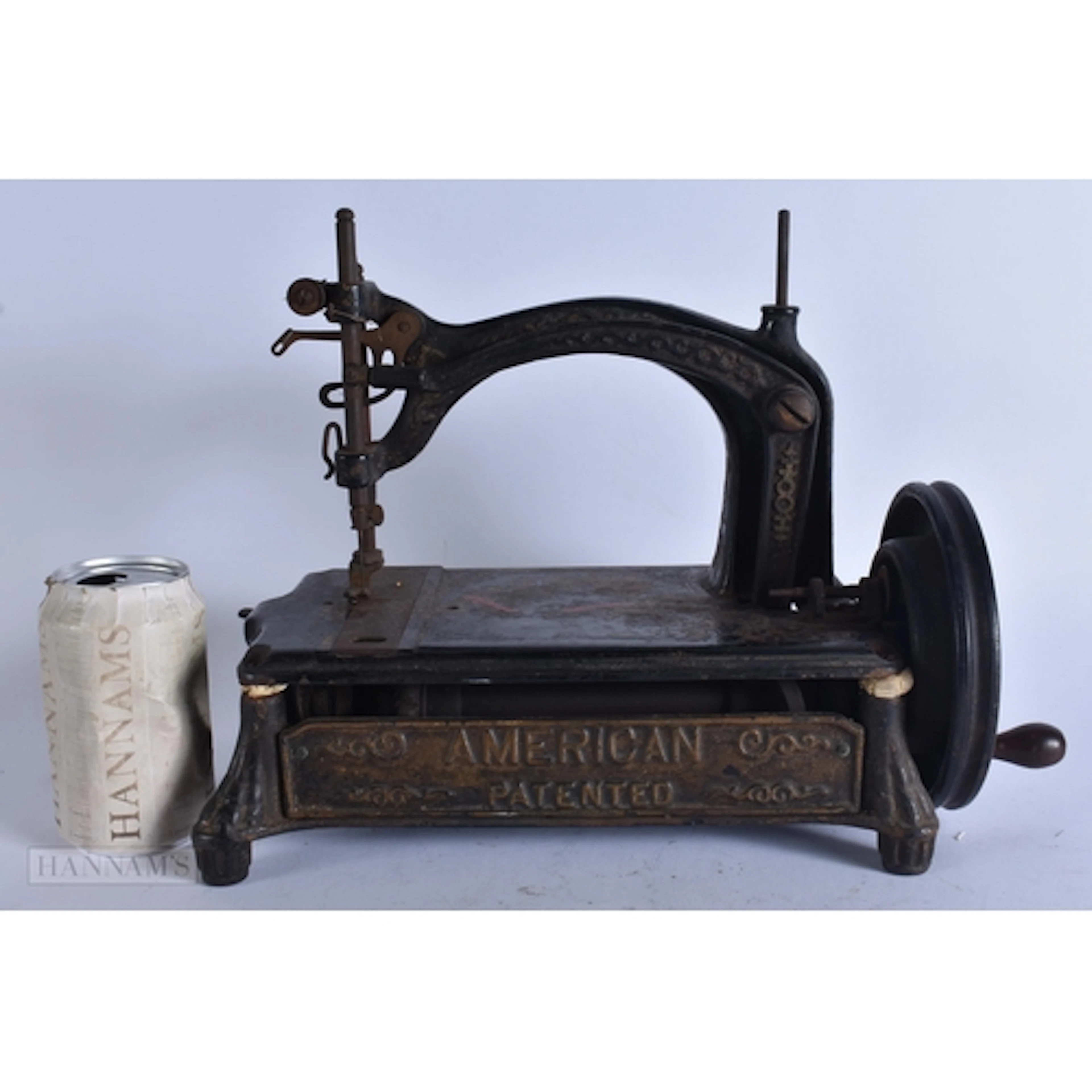 AN ANTIQUE AMERICAN PATENTED CAST IRON SEWING MACHINE. 34 cm...