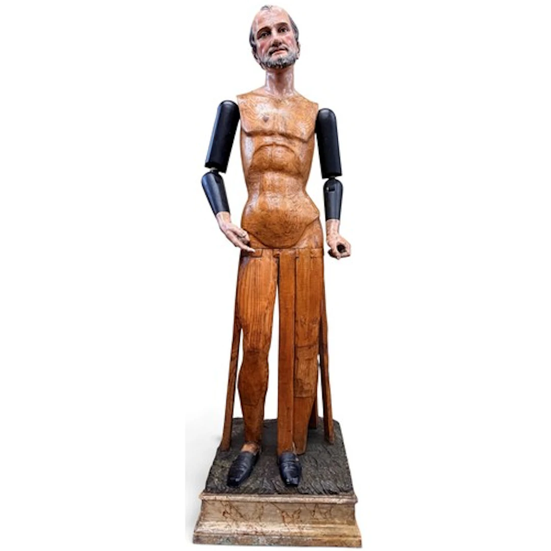 A large and impressive life size articulated carved wood mal...