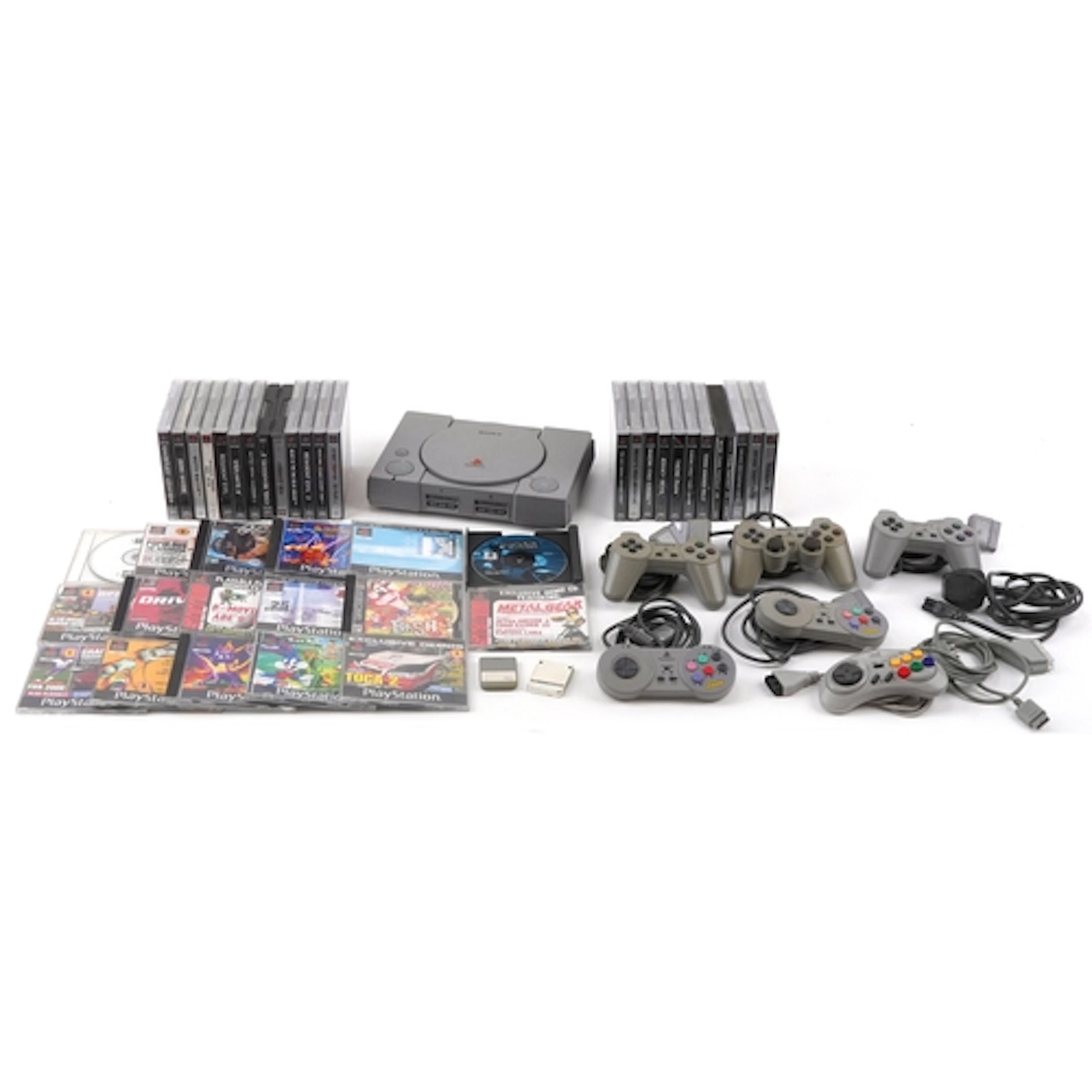 Sony PlayStation one games console with a selection of contr...