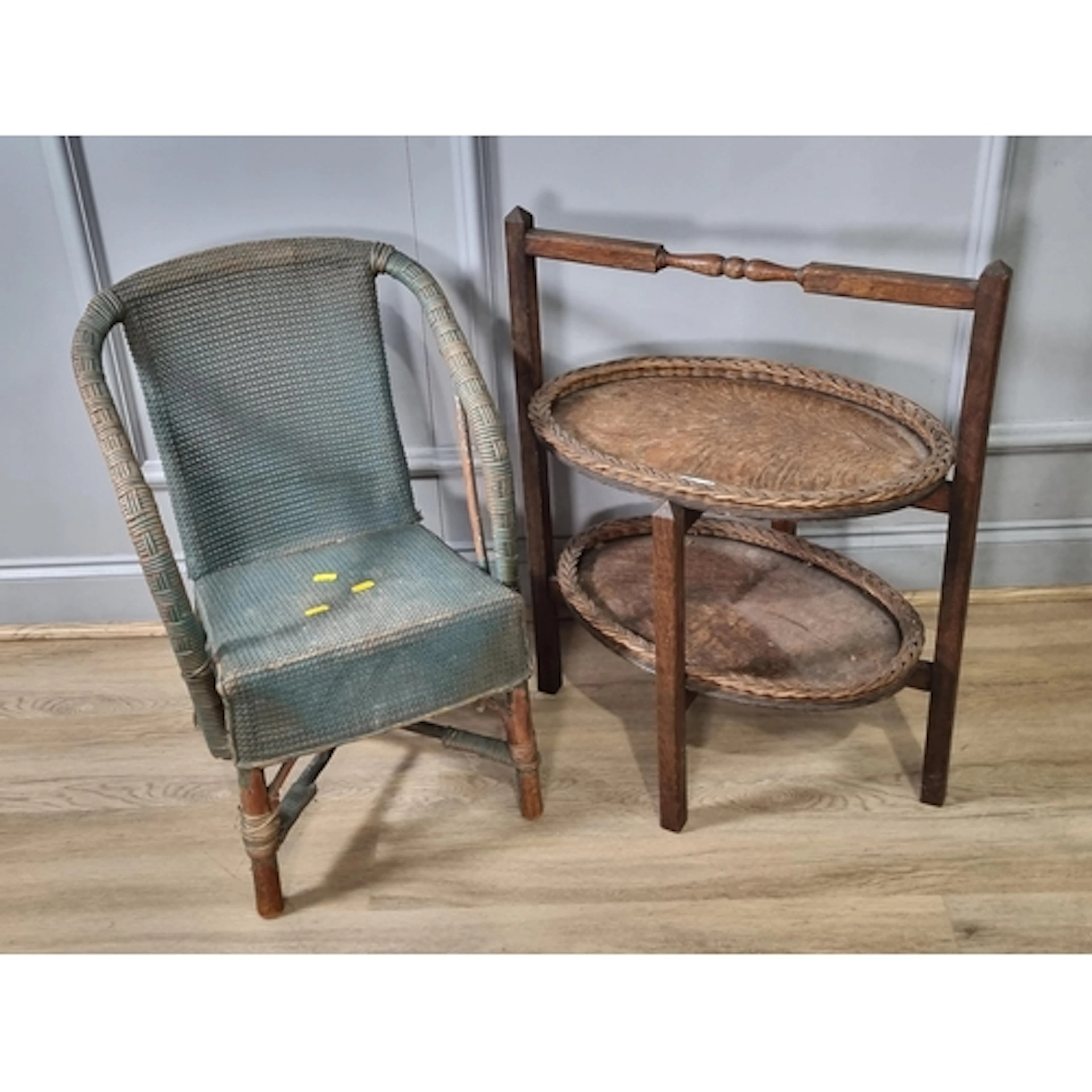 An oak two-tier folding Cake Stand and a child's wicker Armc...