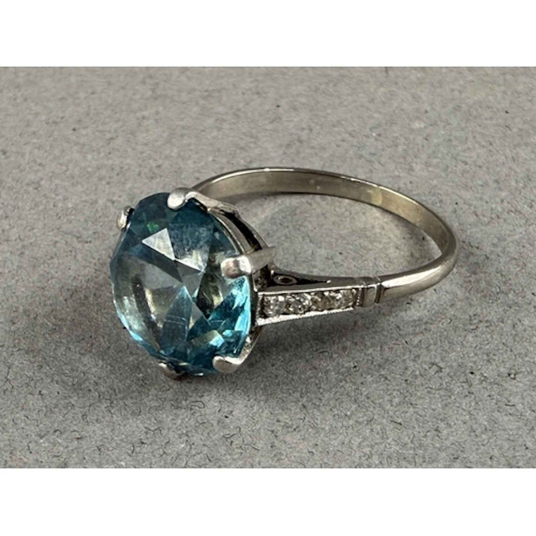 Jewellery- Unmarked white metal ring set with large blue zir...