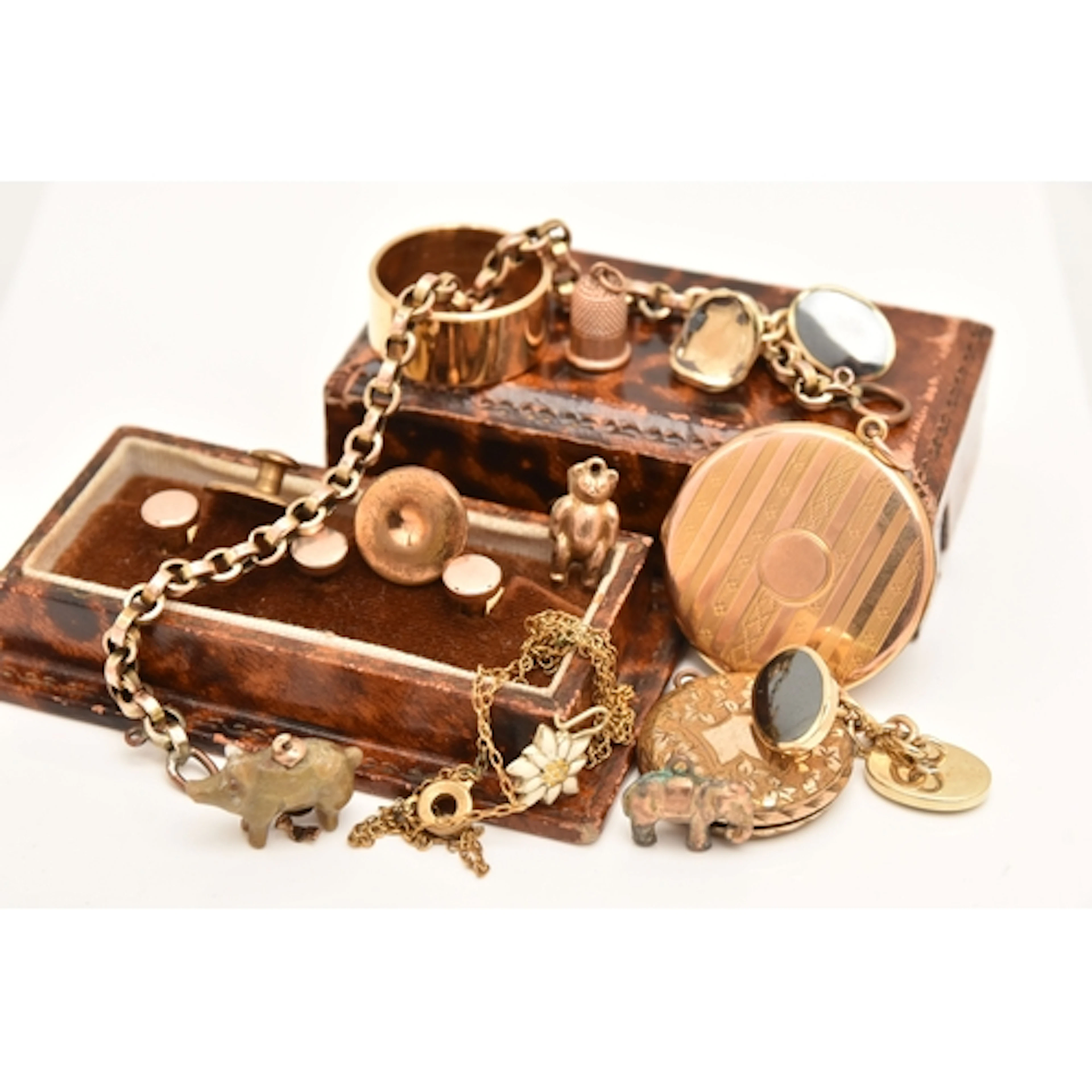 AN ASSORTMENT OF JEWELLERY, to include three small yellow me...