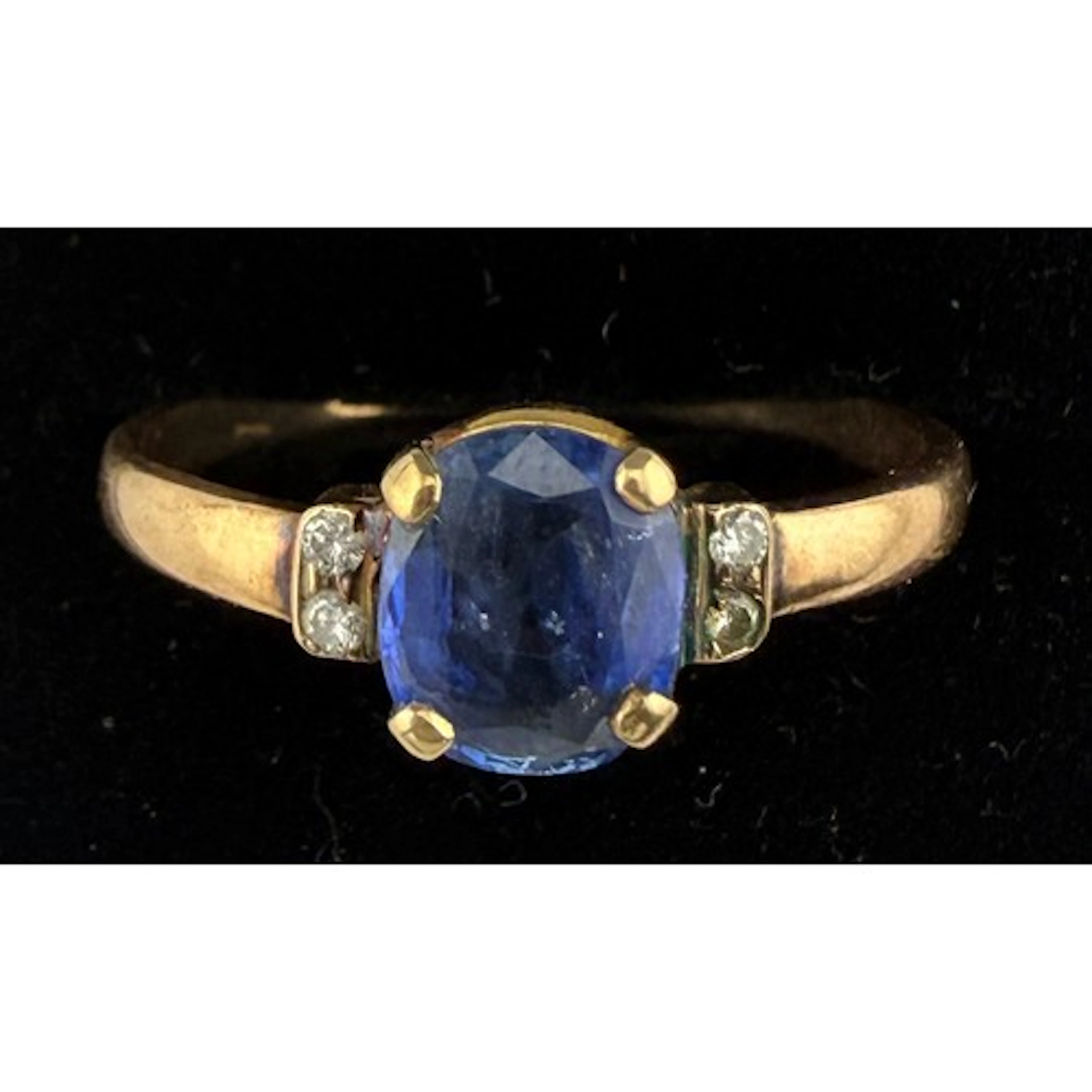 A yellow metal ring, tests as 9 carat gold set with Ceylon s...
