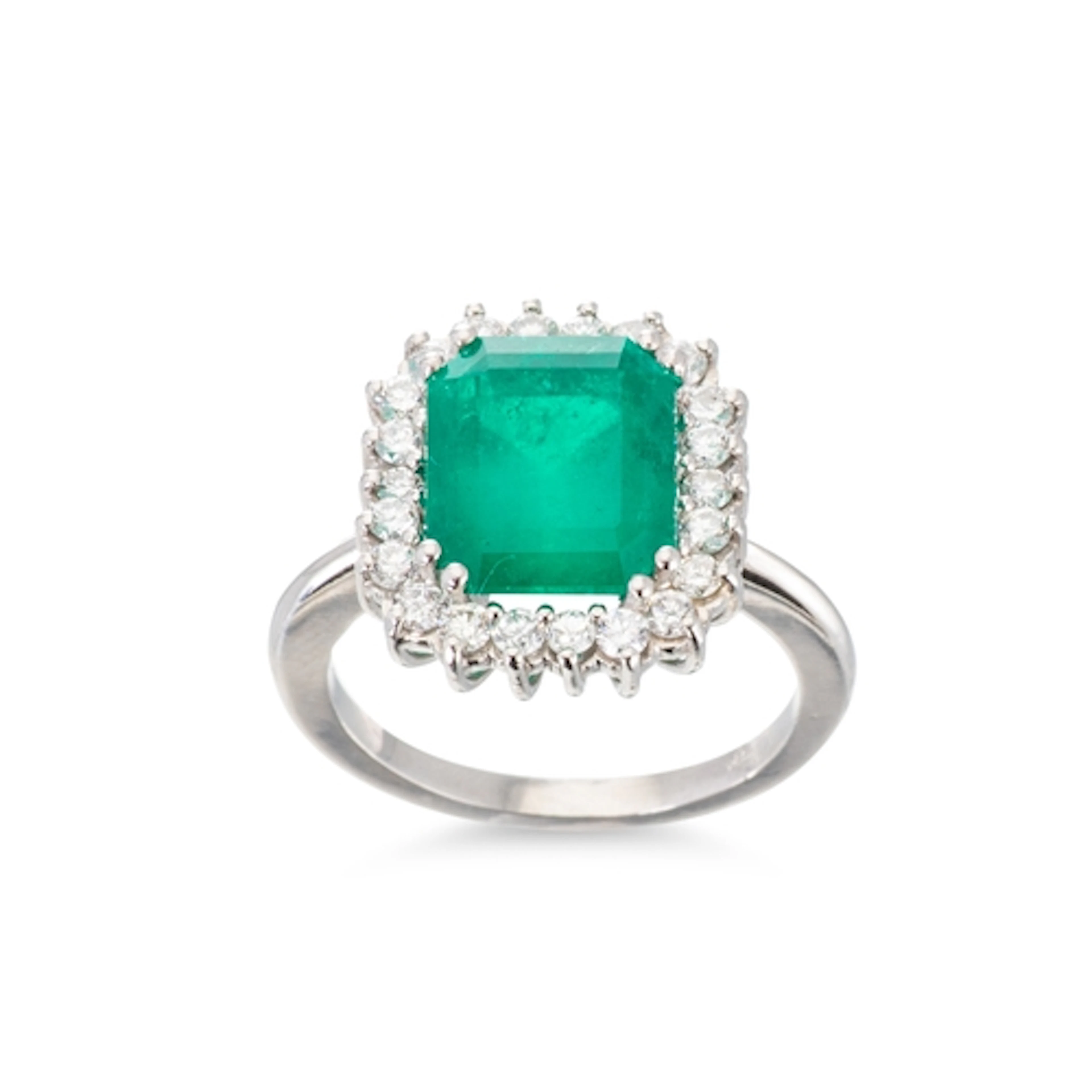 AN IMPRESSIVE EMERALD AND DIAMOND CLUSTER RING, the emerald ...