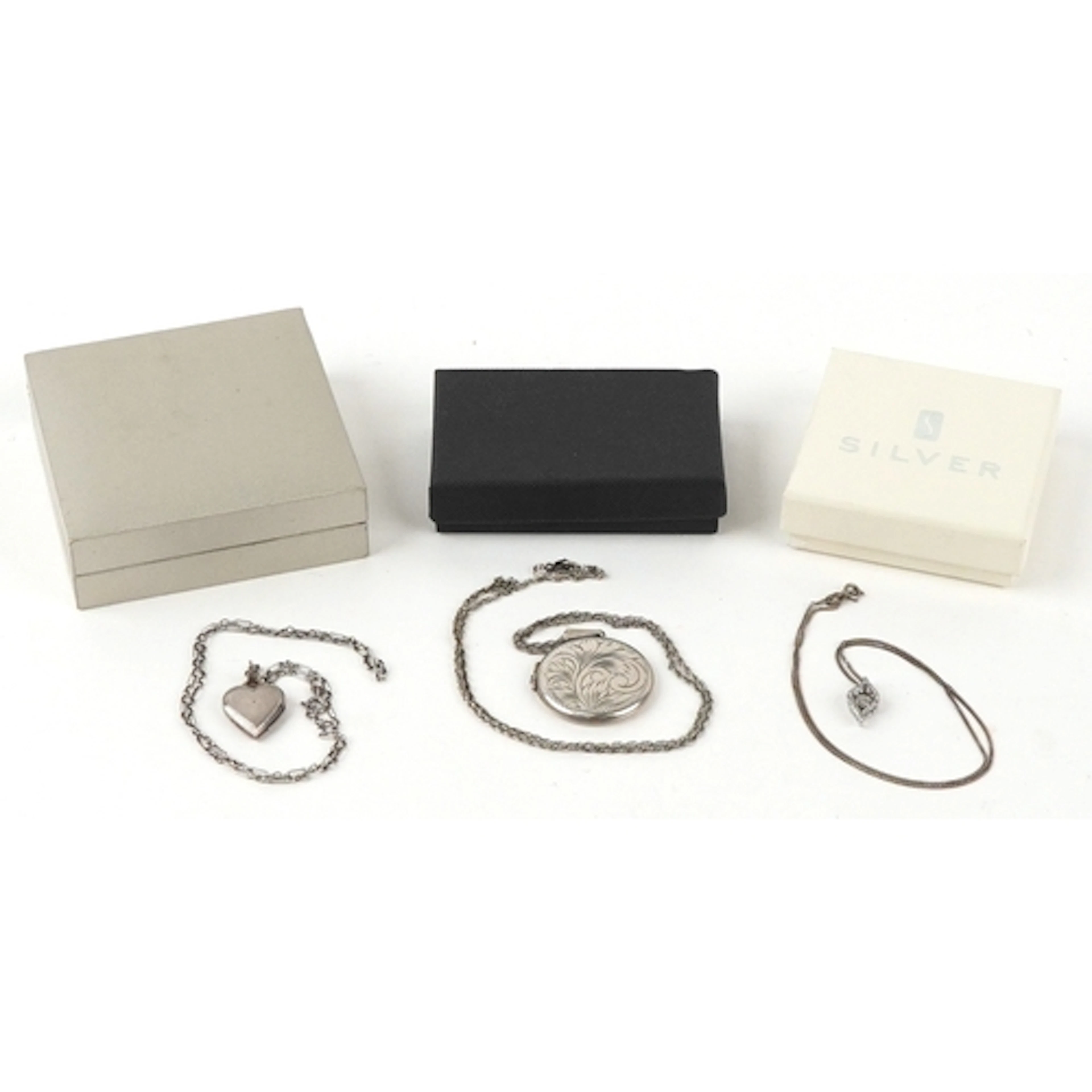 Silver jewellery comprising circular floral engraved locket ...