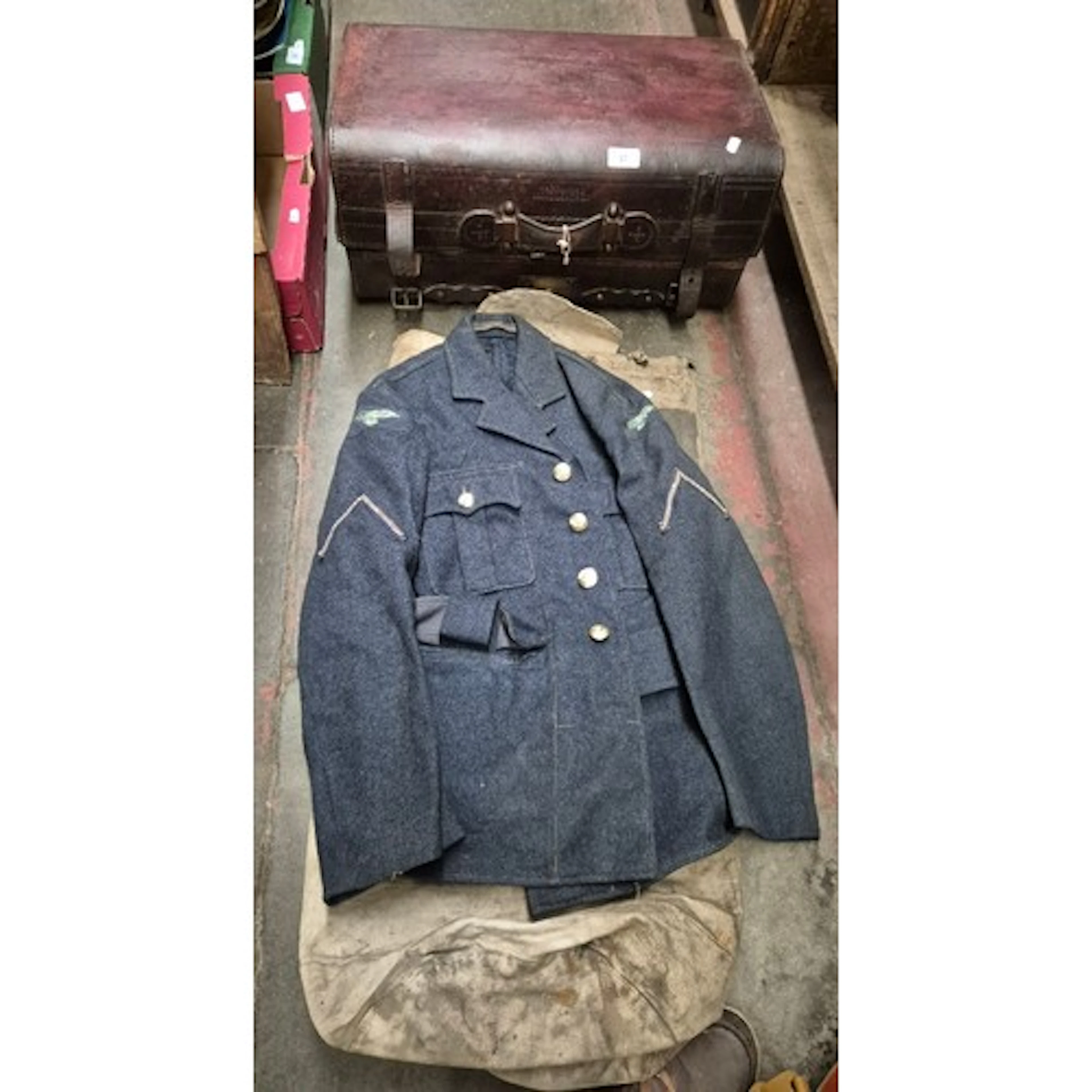 A vintage leather suitcase together with a military kit bag ...