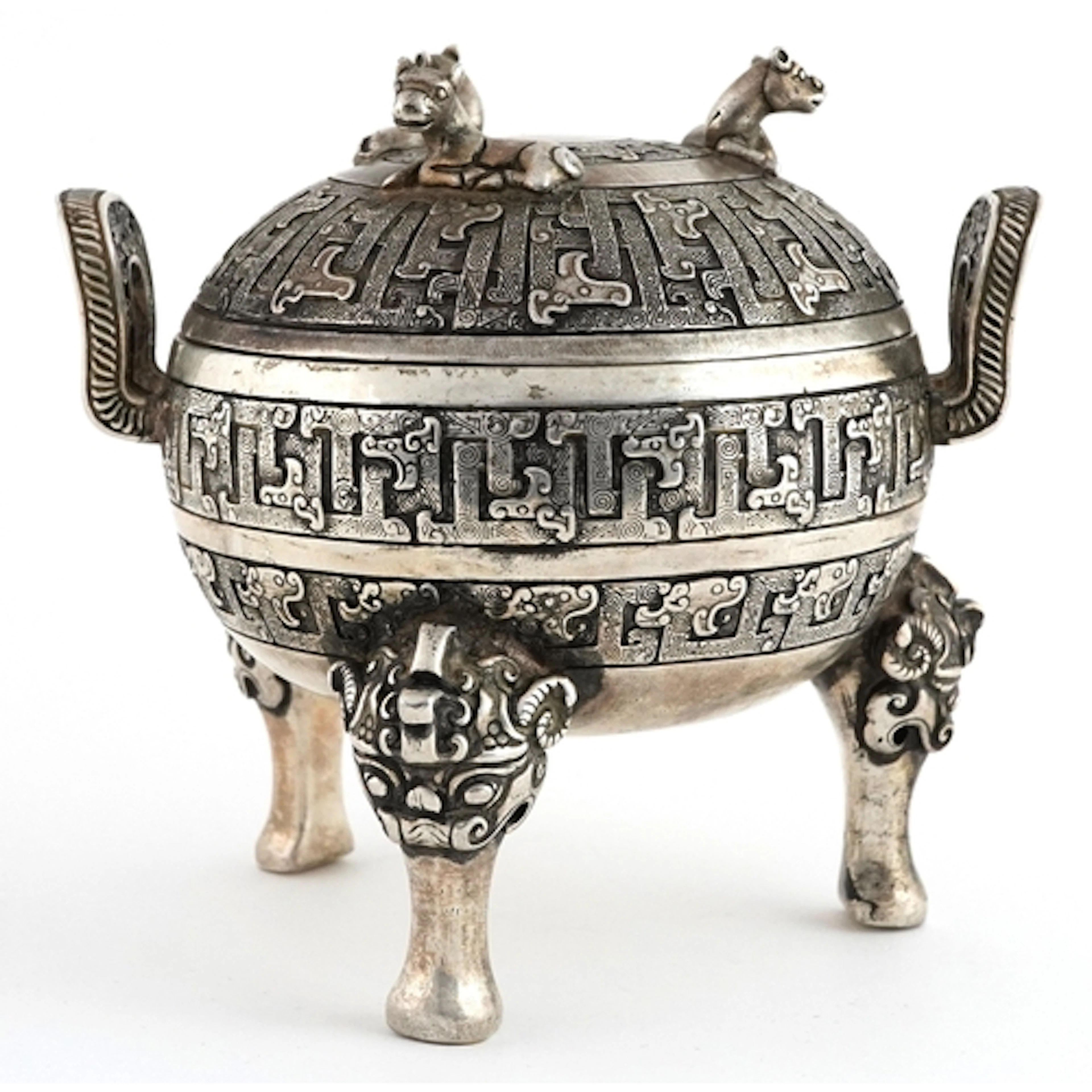 Chinese white metal lidded tripod censer decorated with anim...