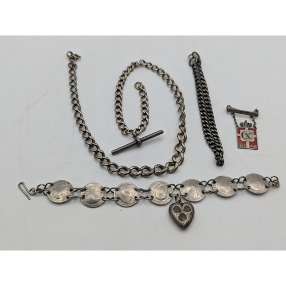 A group of silver and white metal items to include a silver ...