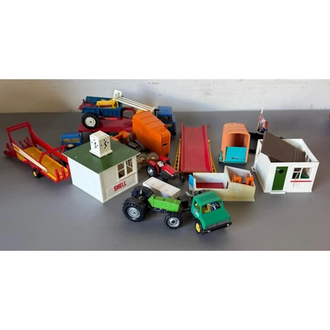 A selection of Britains Farm vehicles and buildings.
