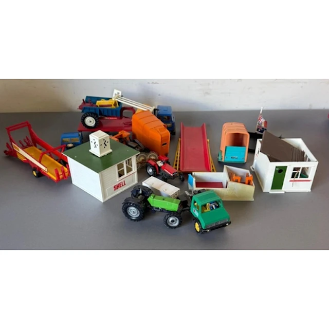 A selection of Britains Farm vehicles and buildings.