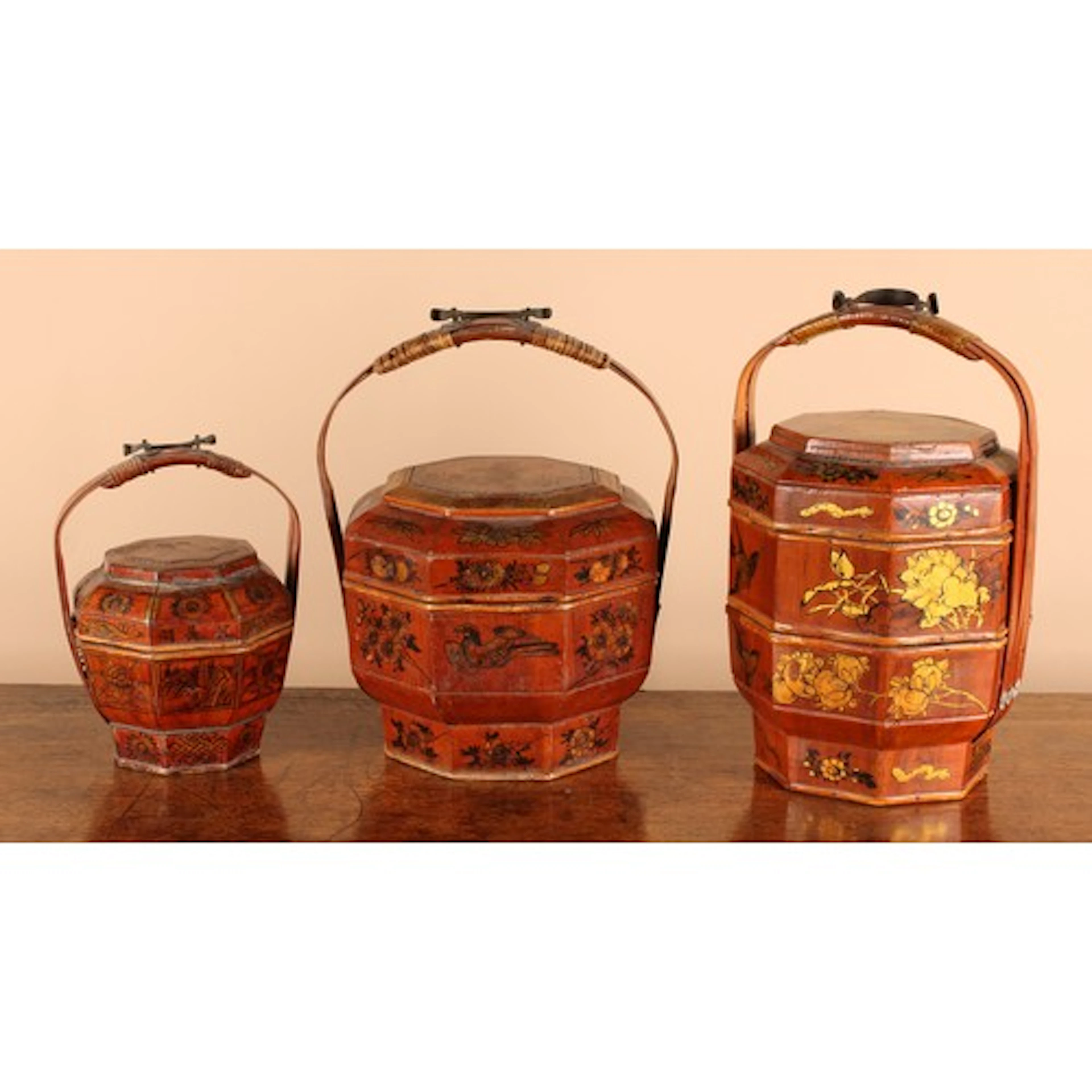 A Chinese octagonal two-tiered wedding basket, decorated in ...