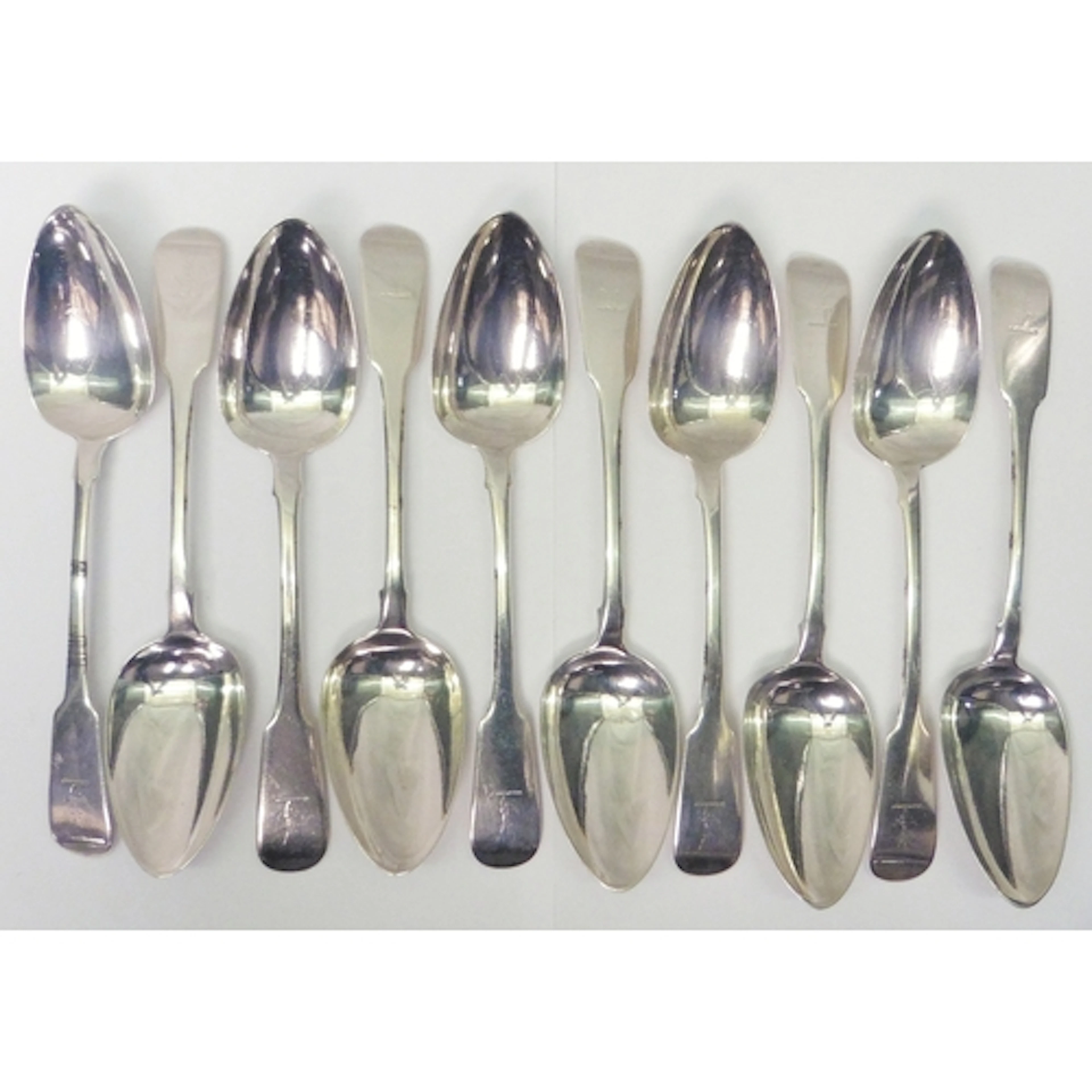 A set of ten George III Irish silver armorial engraved fiddl...