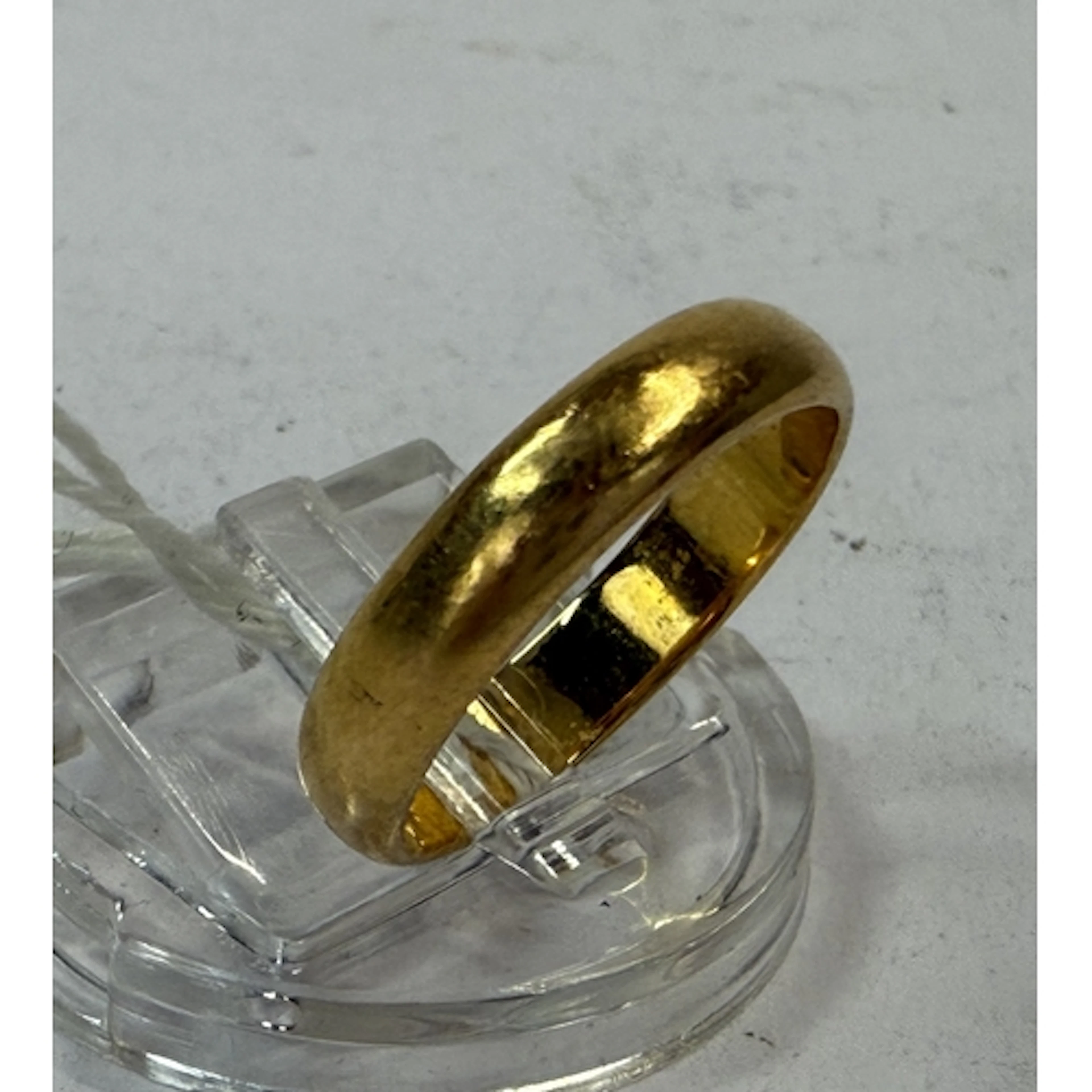Jewellery: a 22ct yellow gold wedding band, Birmingham 1953,...