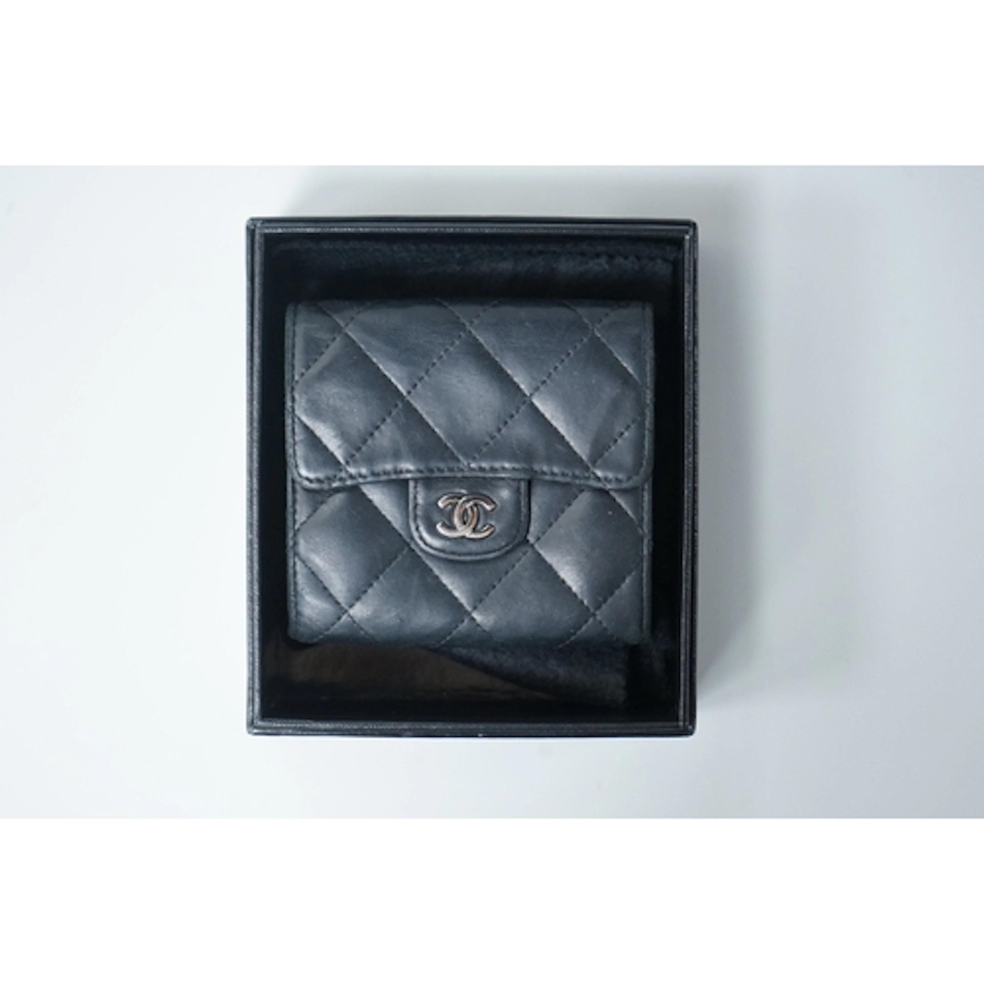 A Chanel classic double flap black leather purse, with origi...