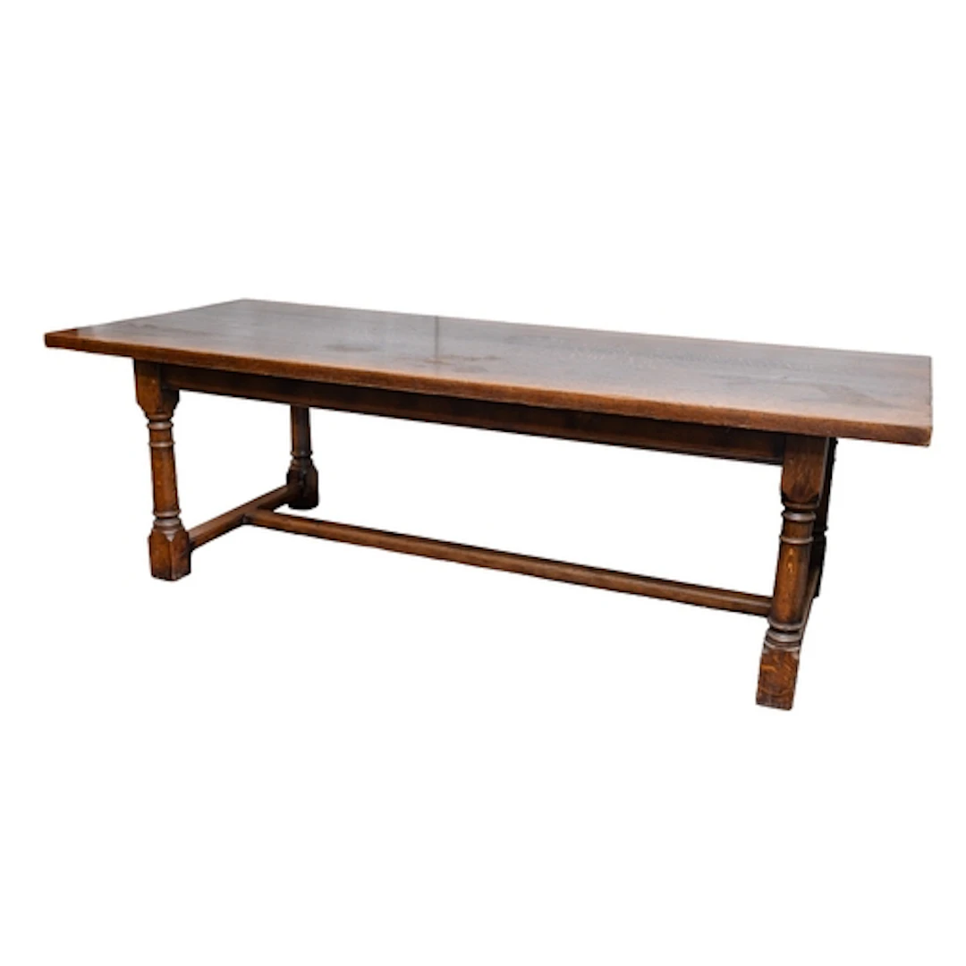 A substantial oak refectory table in 17th century style; the...