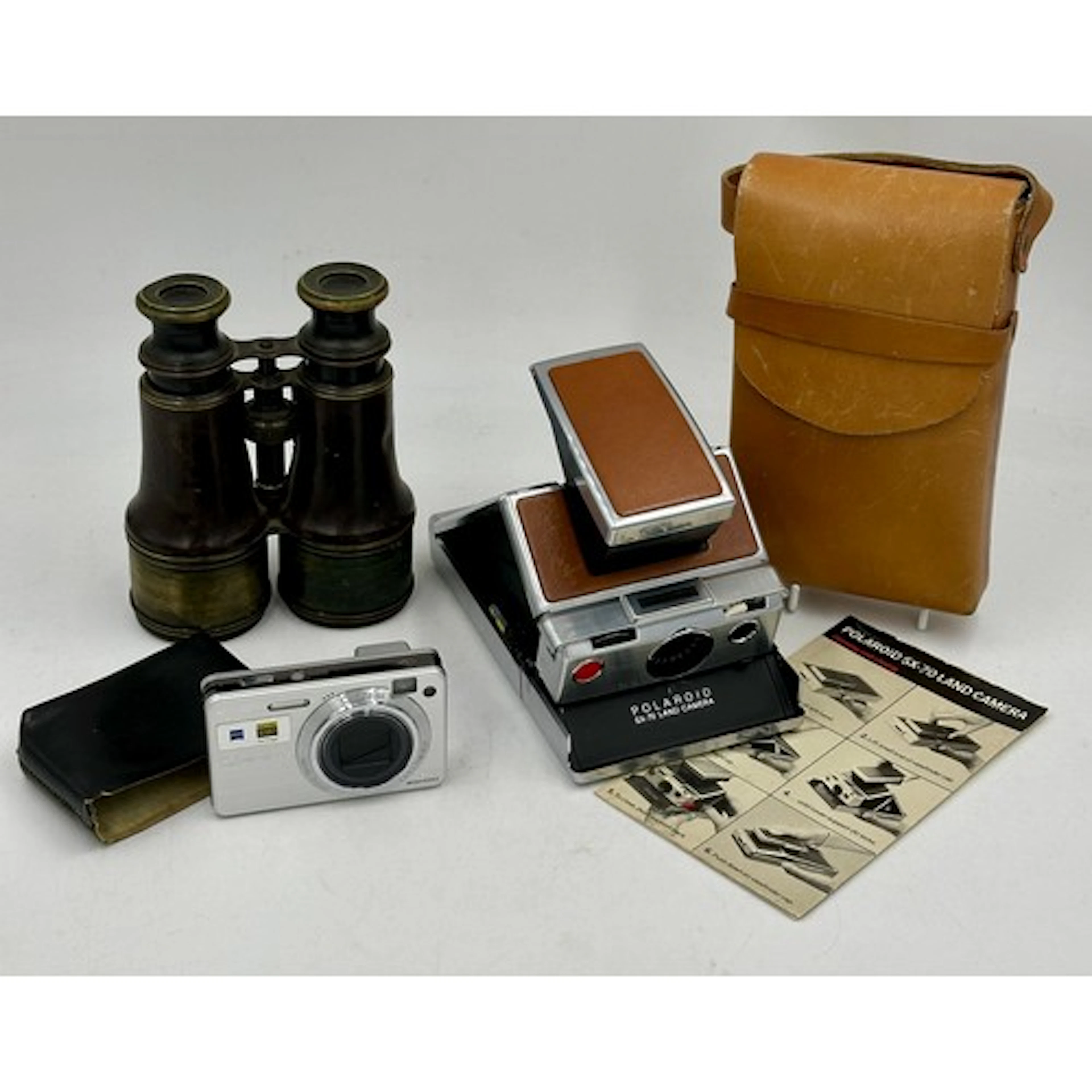 A Polaroid SX-70 Land camera in original case, a Sony Cyber-...
