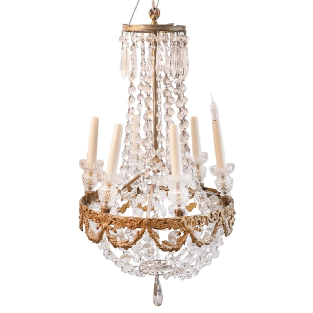 A gilt metal and cut glass six-light chandelier in Regency t...