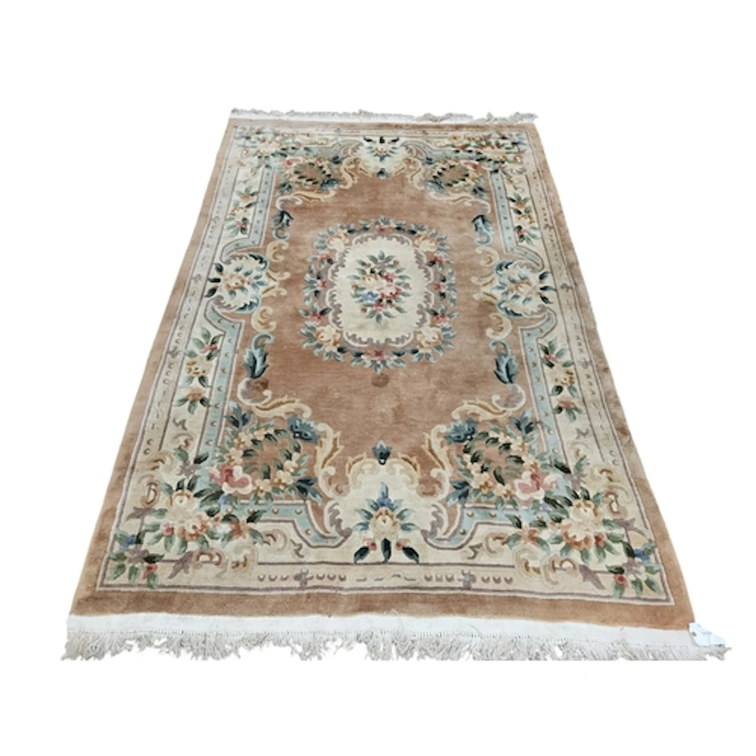 A cream and brown ground Rug with multi borders and central ...