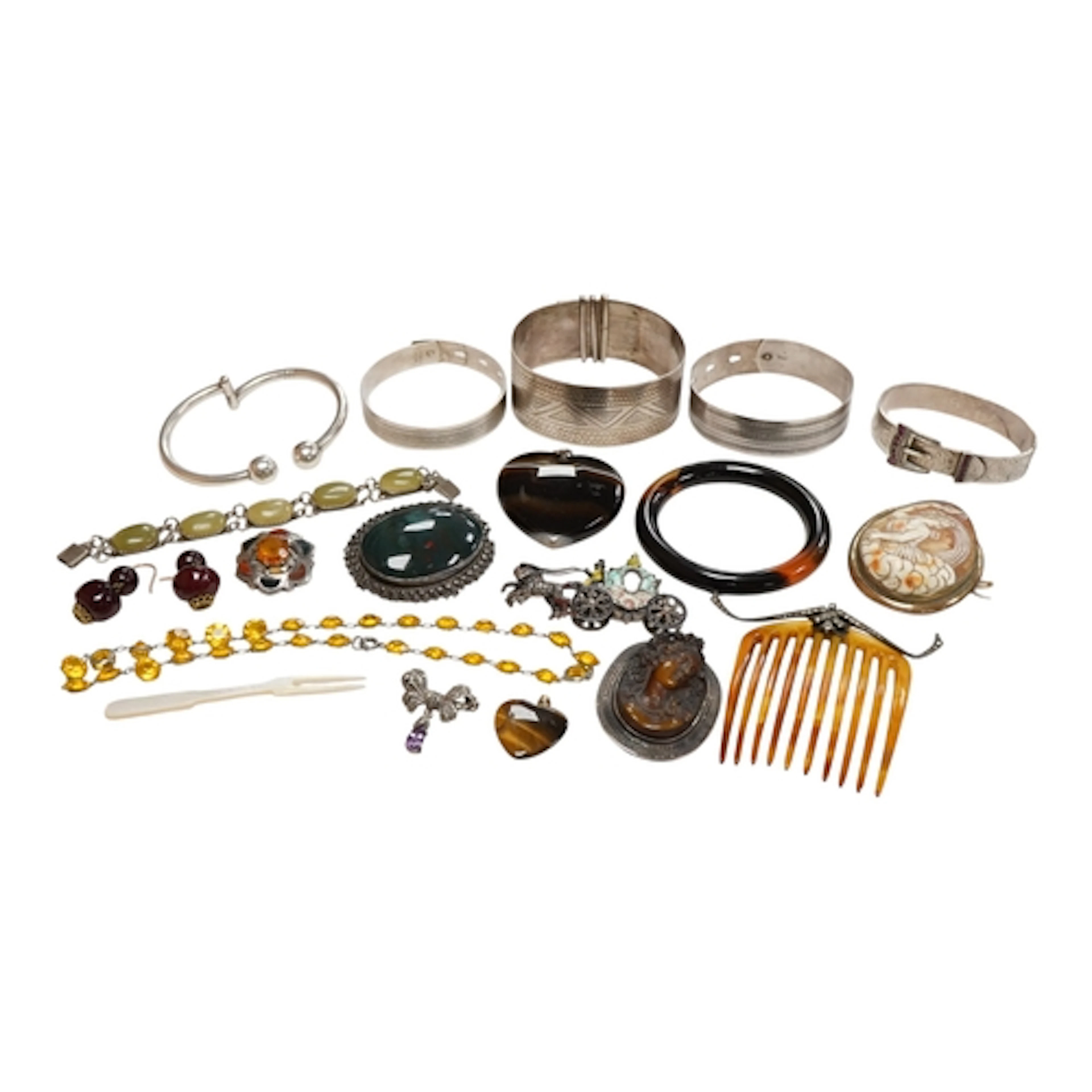 A collection of jewels including a tiger's eye quartz heart ...