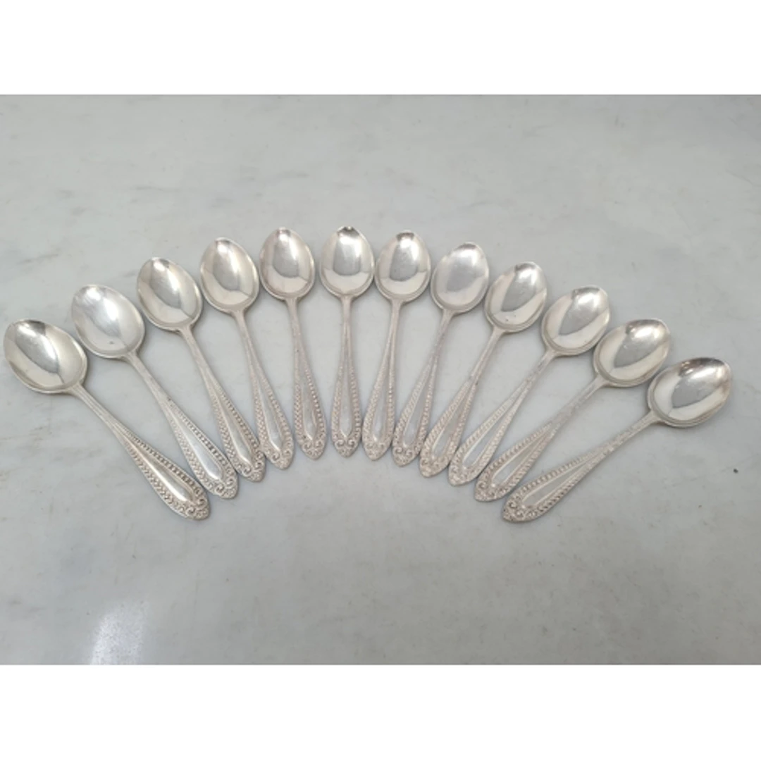 One dozen Elizabeth II silver Teaspoons with bead and scroll...