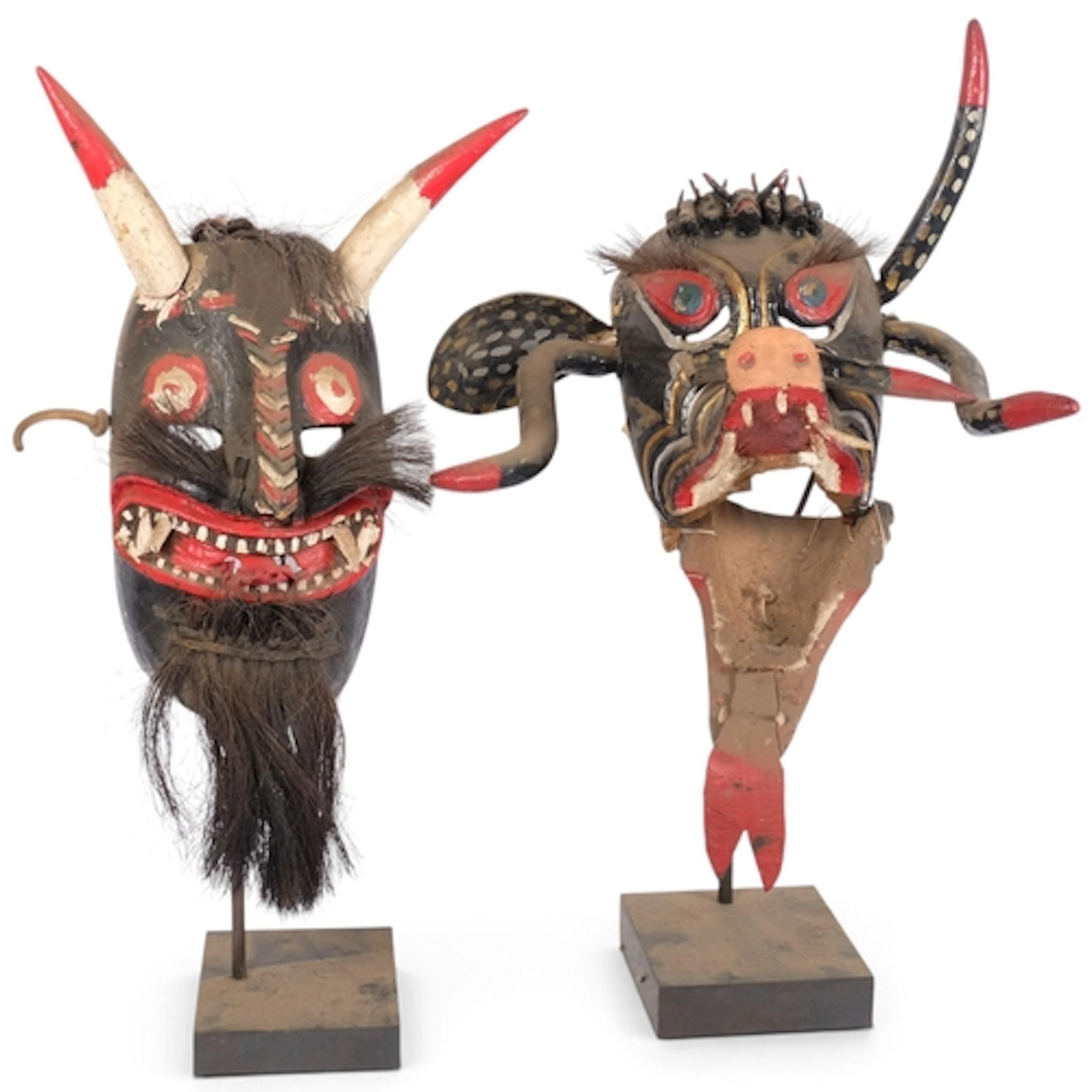 2 decorative carved and painted wood Tribal devil masks