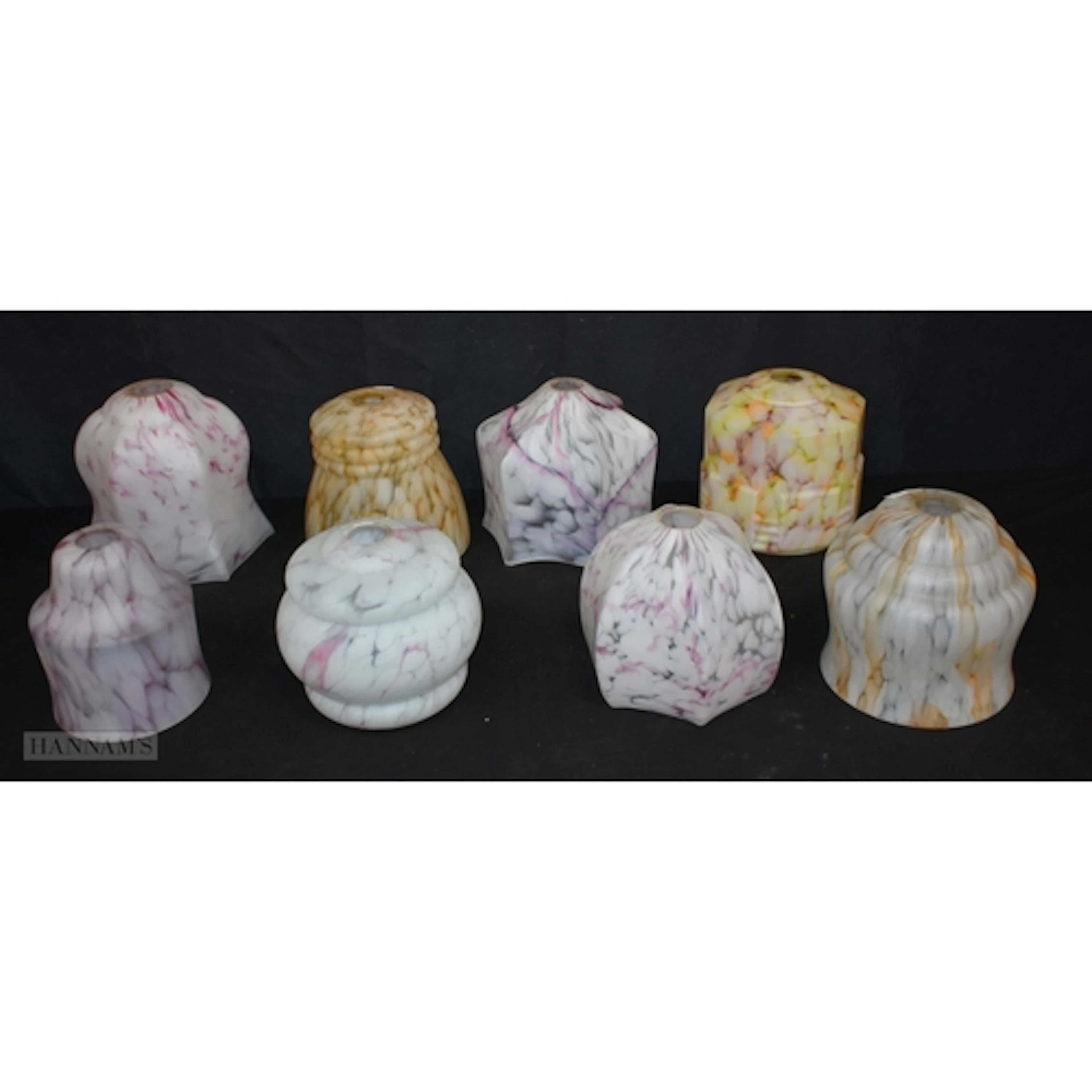 A collection of vintage Art Deco style marbled glass lampsha...