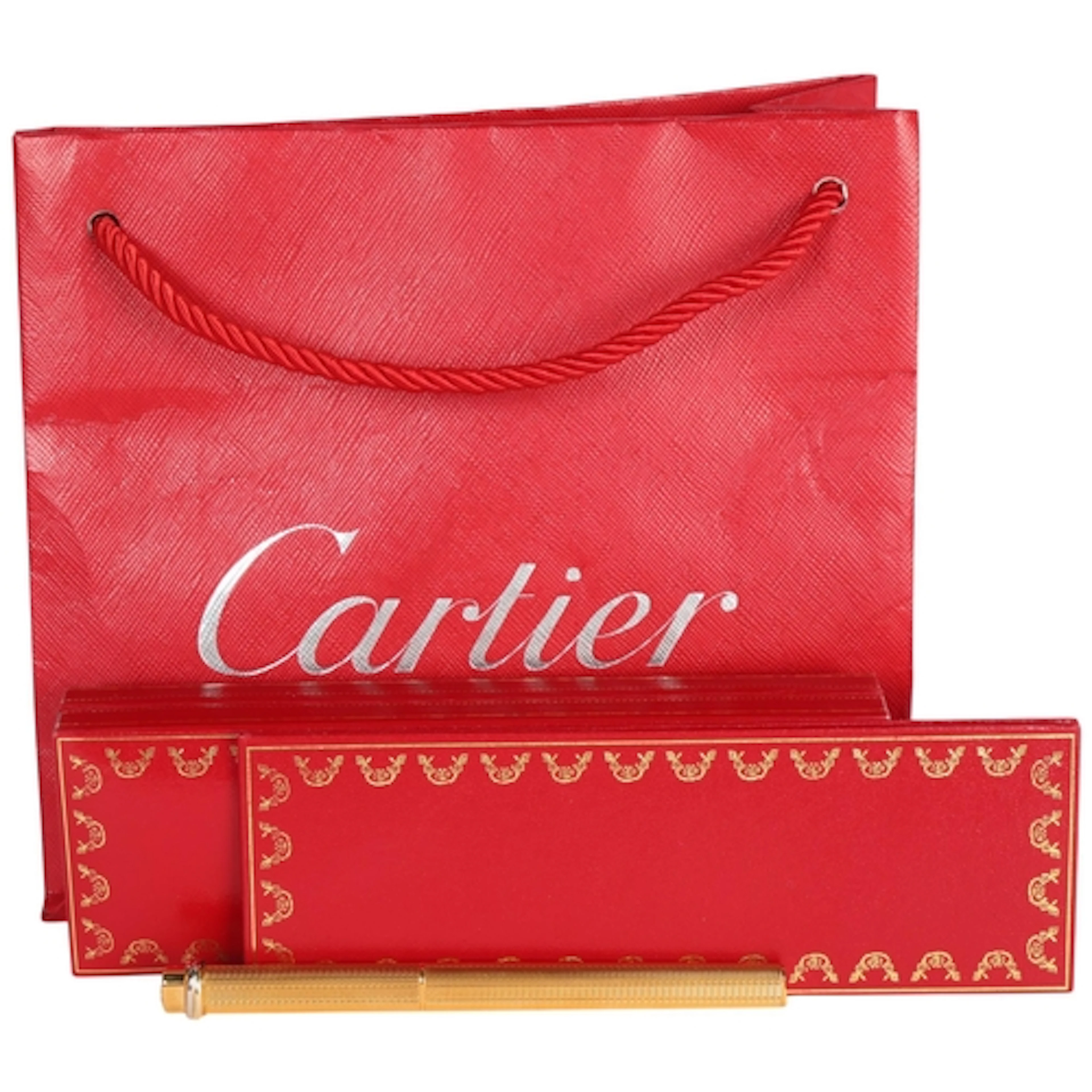 Les Must de Cartier, a gold plated Vendome oval ballpoint pe...
