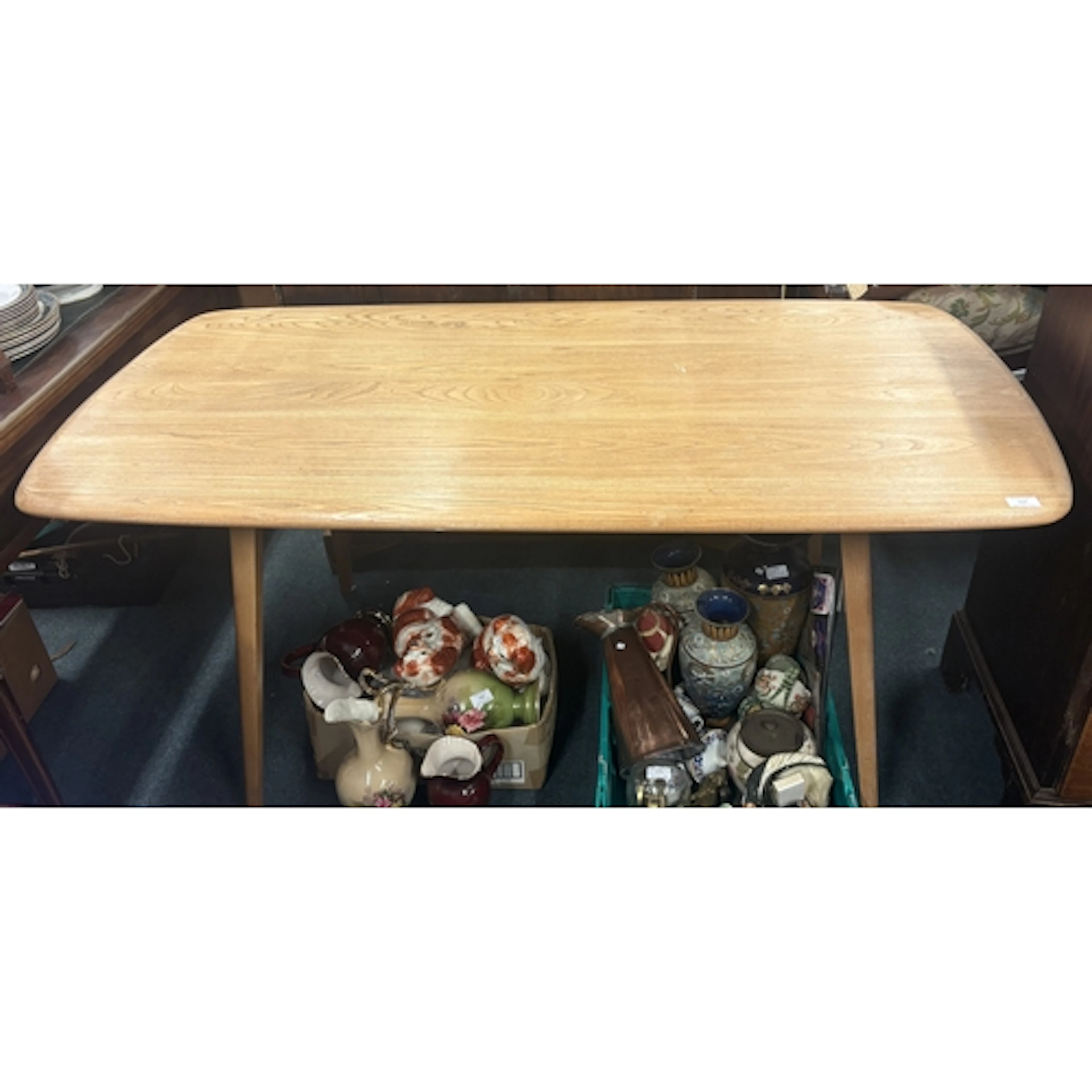 ERCOL: A kitchen table. Est. £60 - £80.