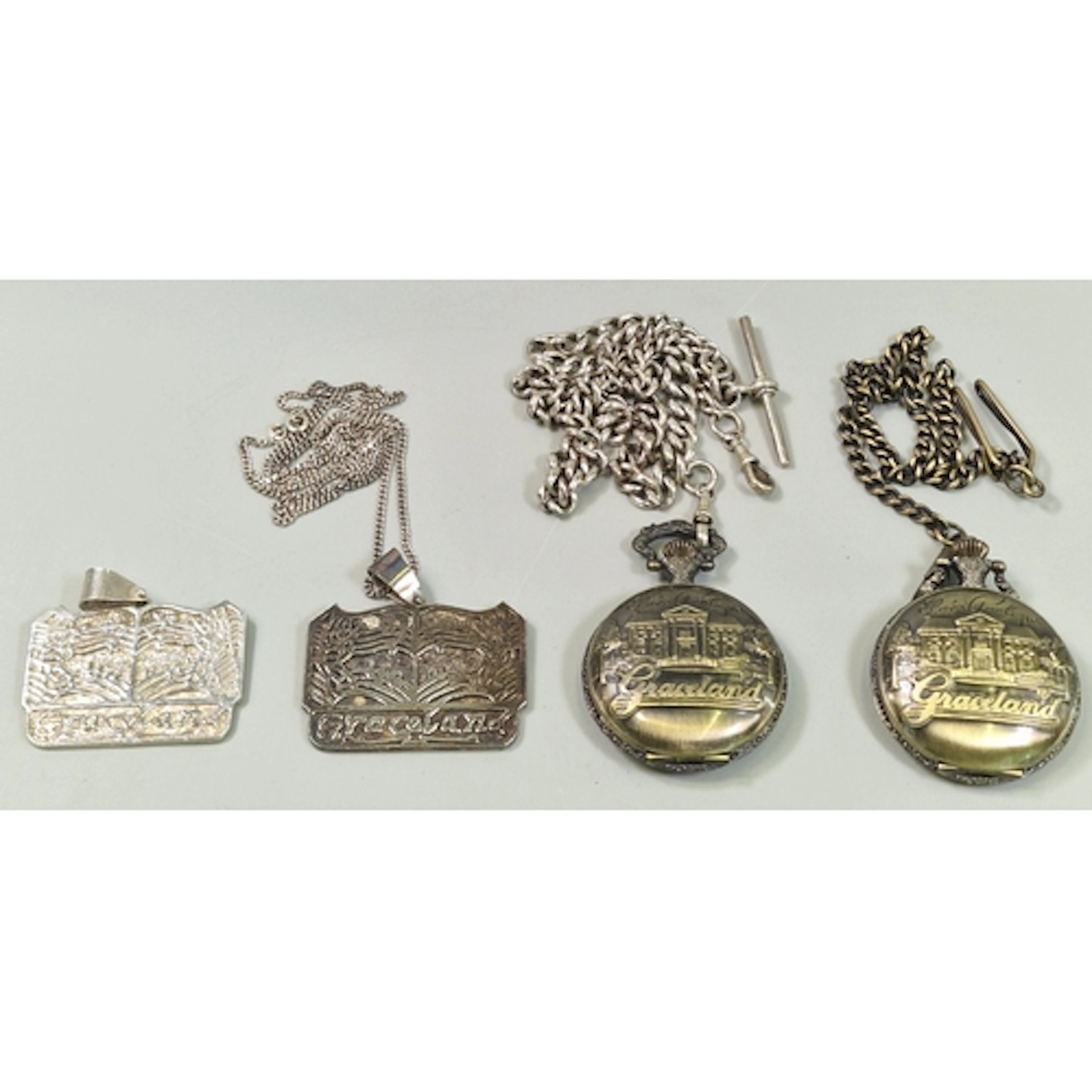 Silver Elvis Presley Graceland pendant on chain together wit...