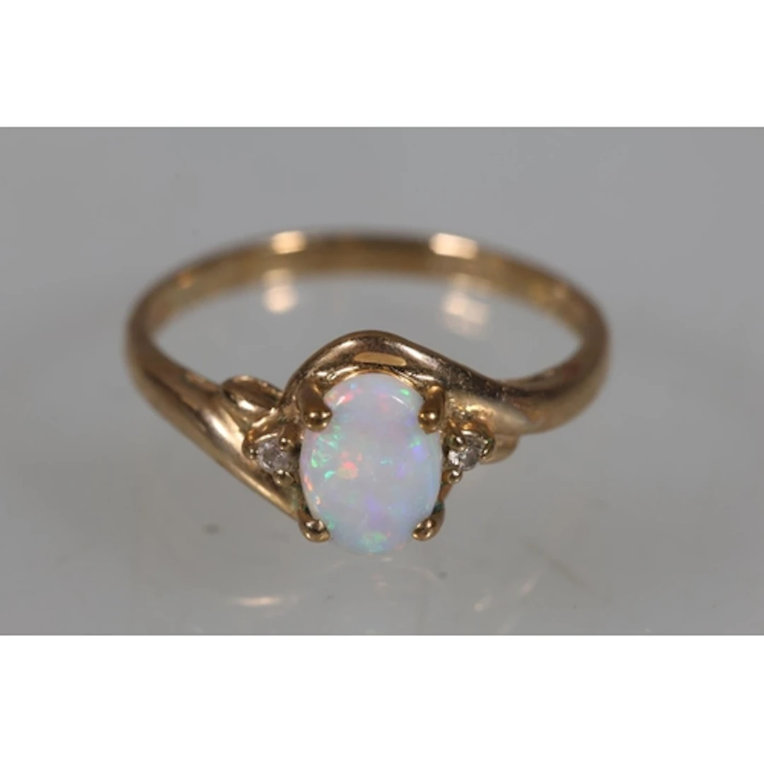 9ct gold opal and diamond ring, size K/L, 1.4g gross.