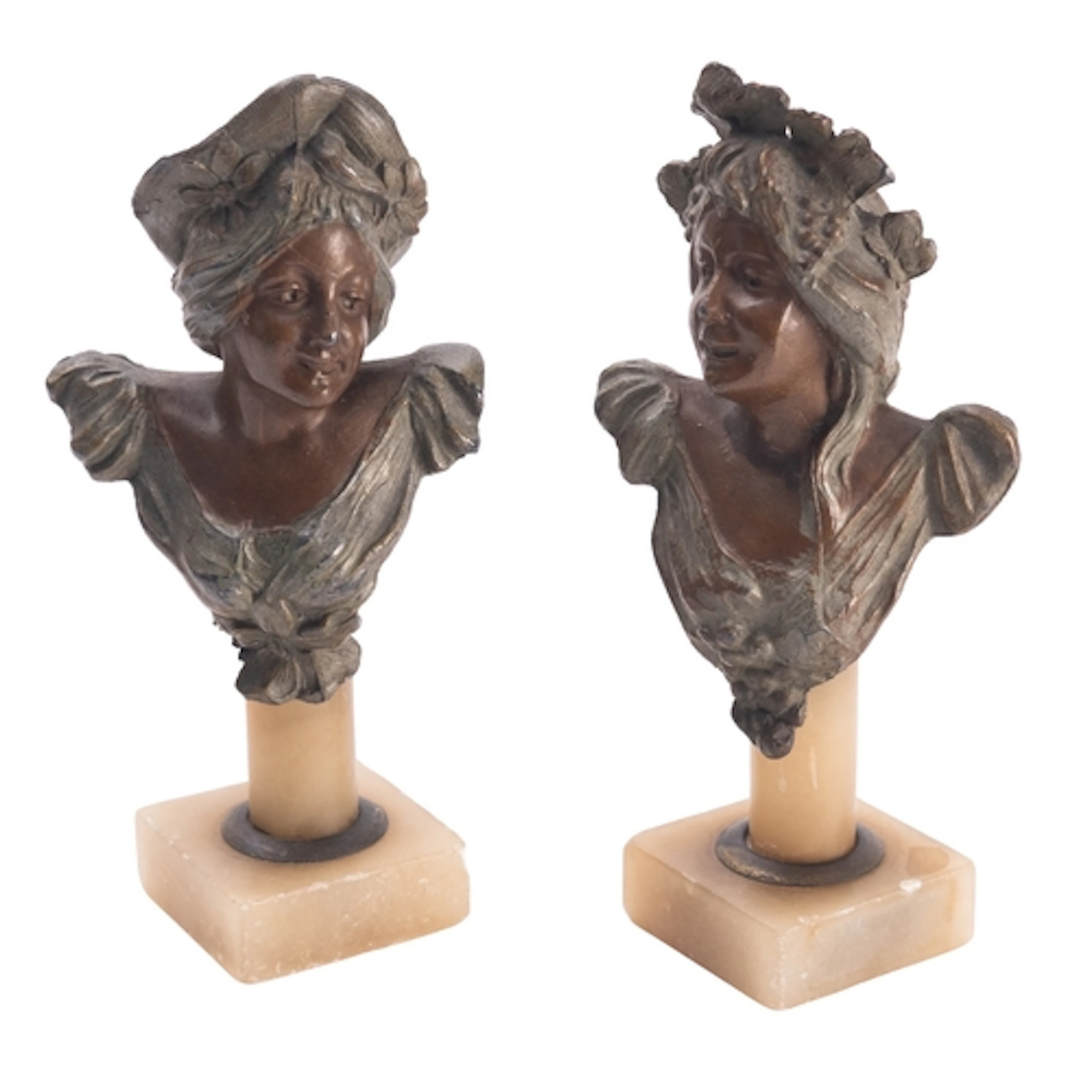 A pair of patinated metal busts of maidens, in Art Nouveau s...