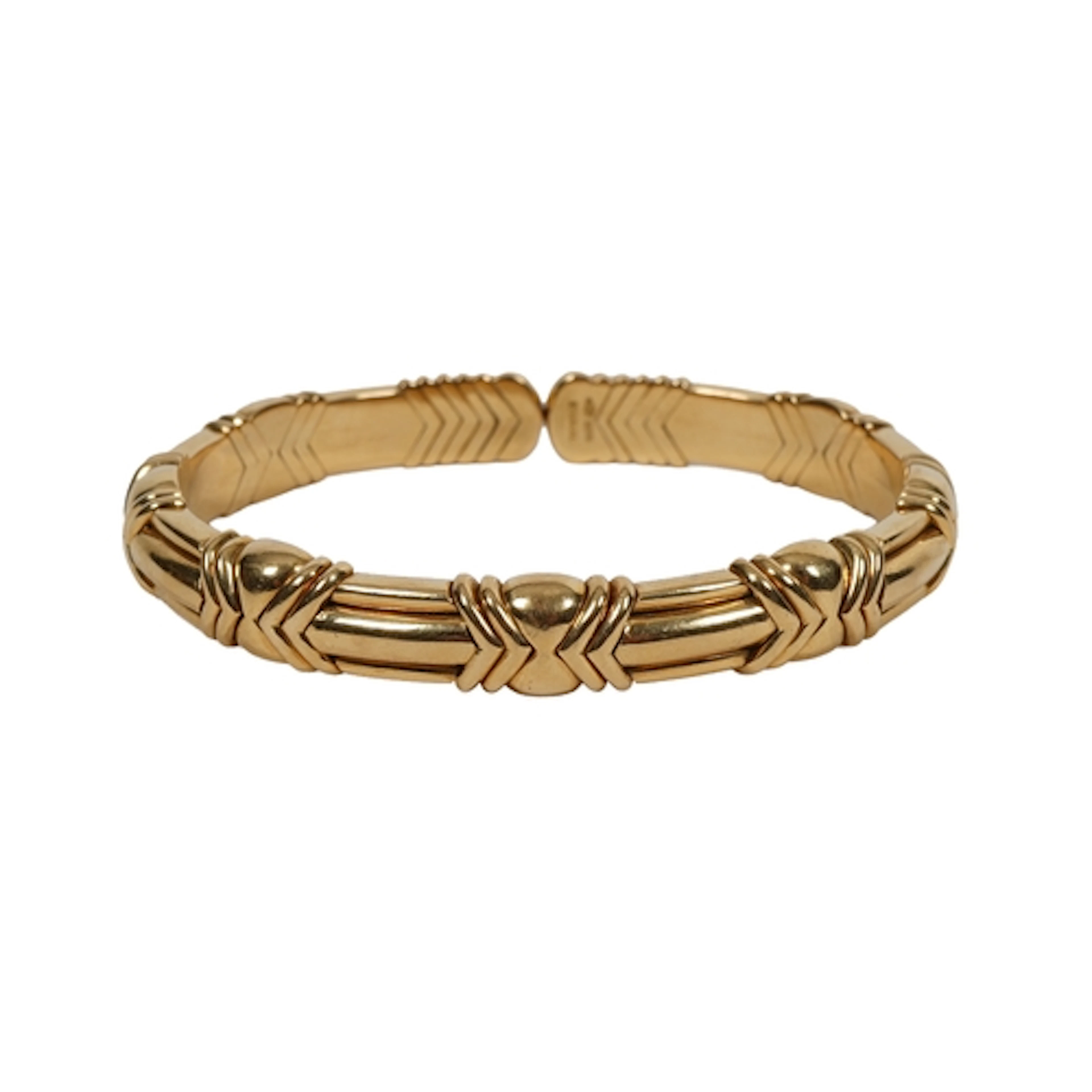 Bulgari, a gold bangle, of flexible design, composed of modu...