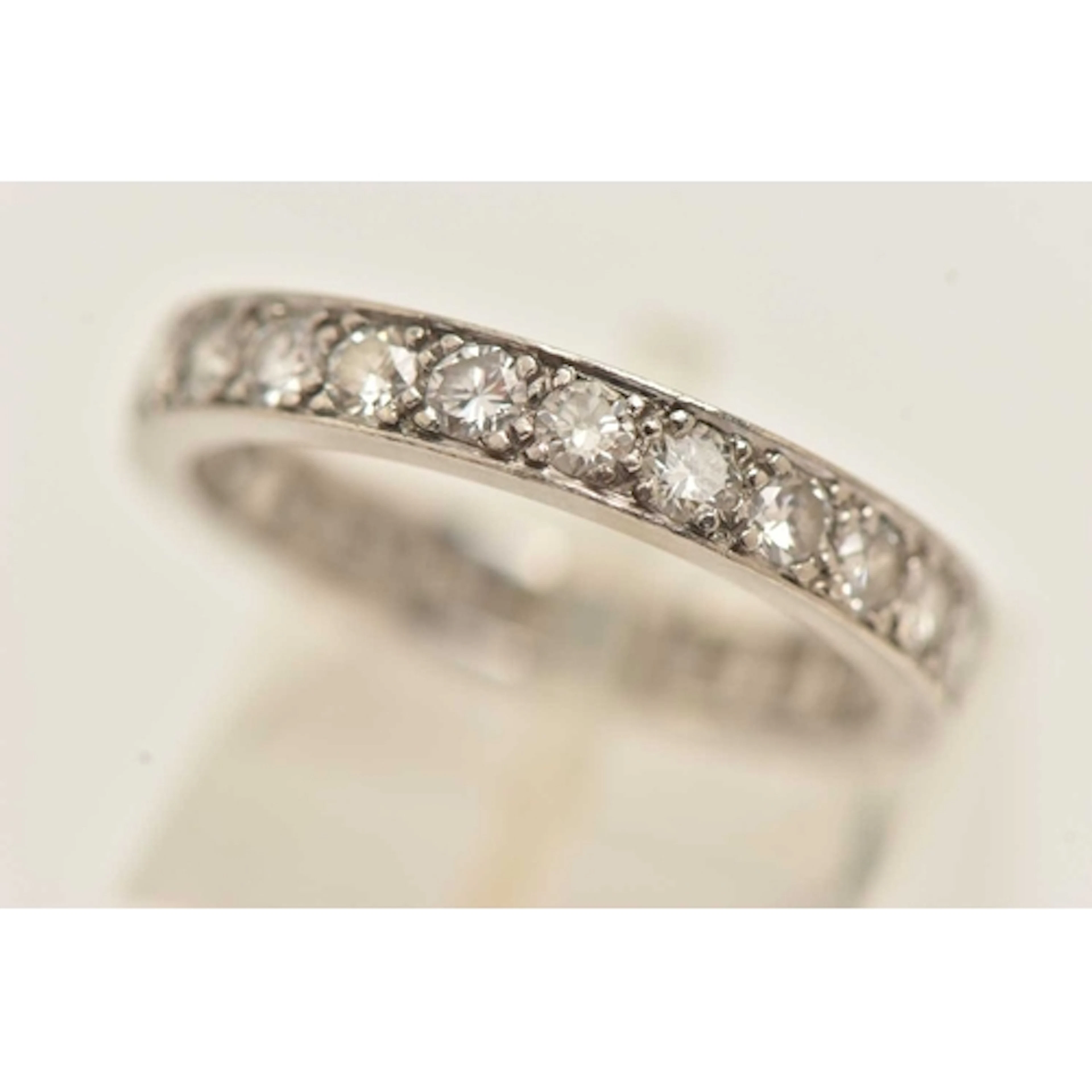 A PLATINUM AND DIAMOND SET ETERNITY BAND RING, twenty four r...