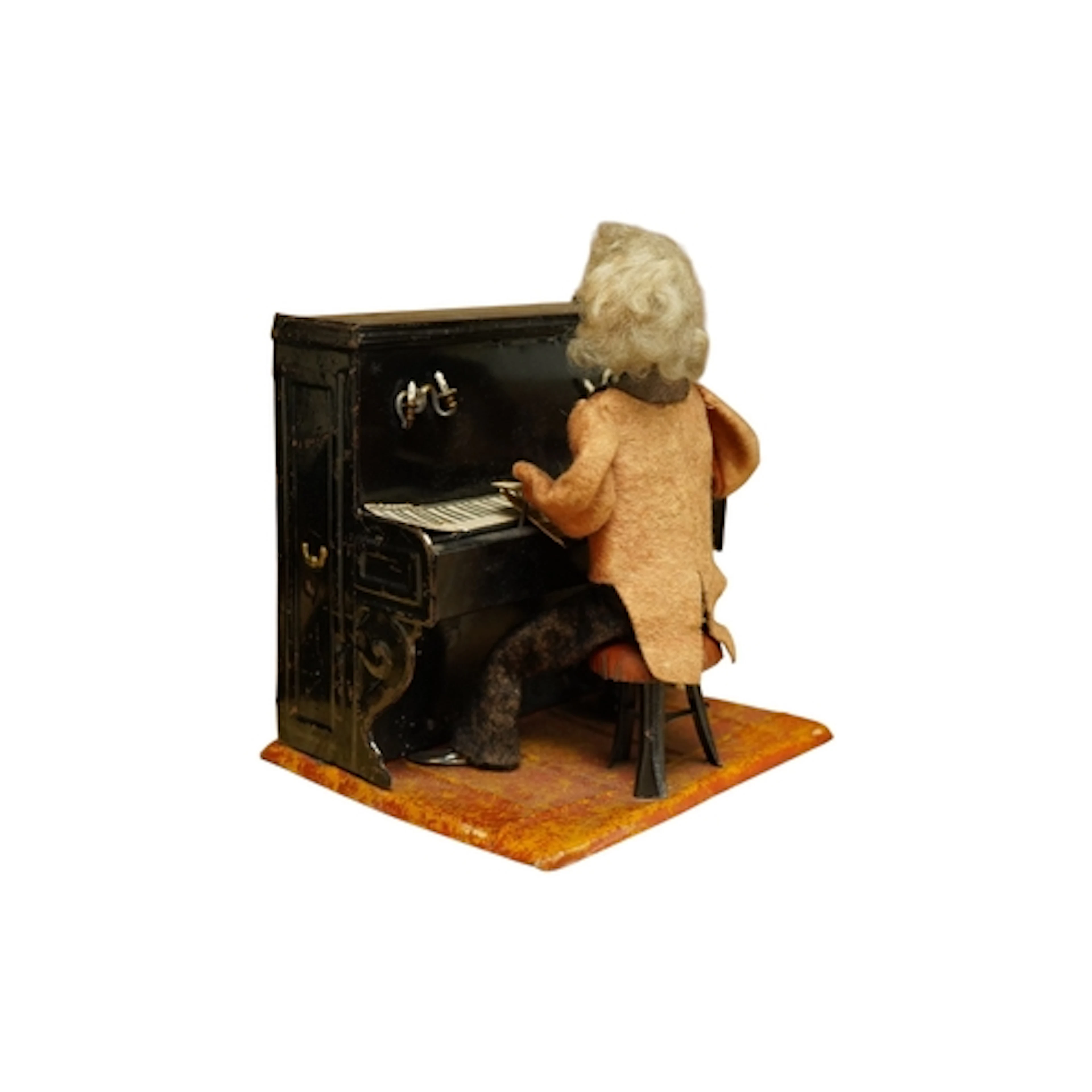 A French F.M.Systeme tin plate clockwork toy pianist, height...