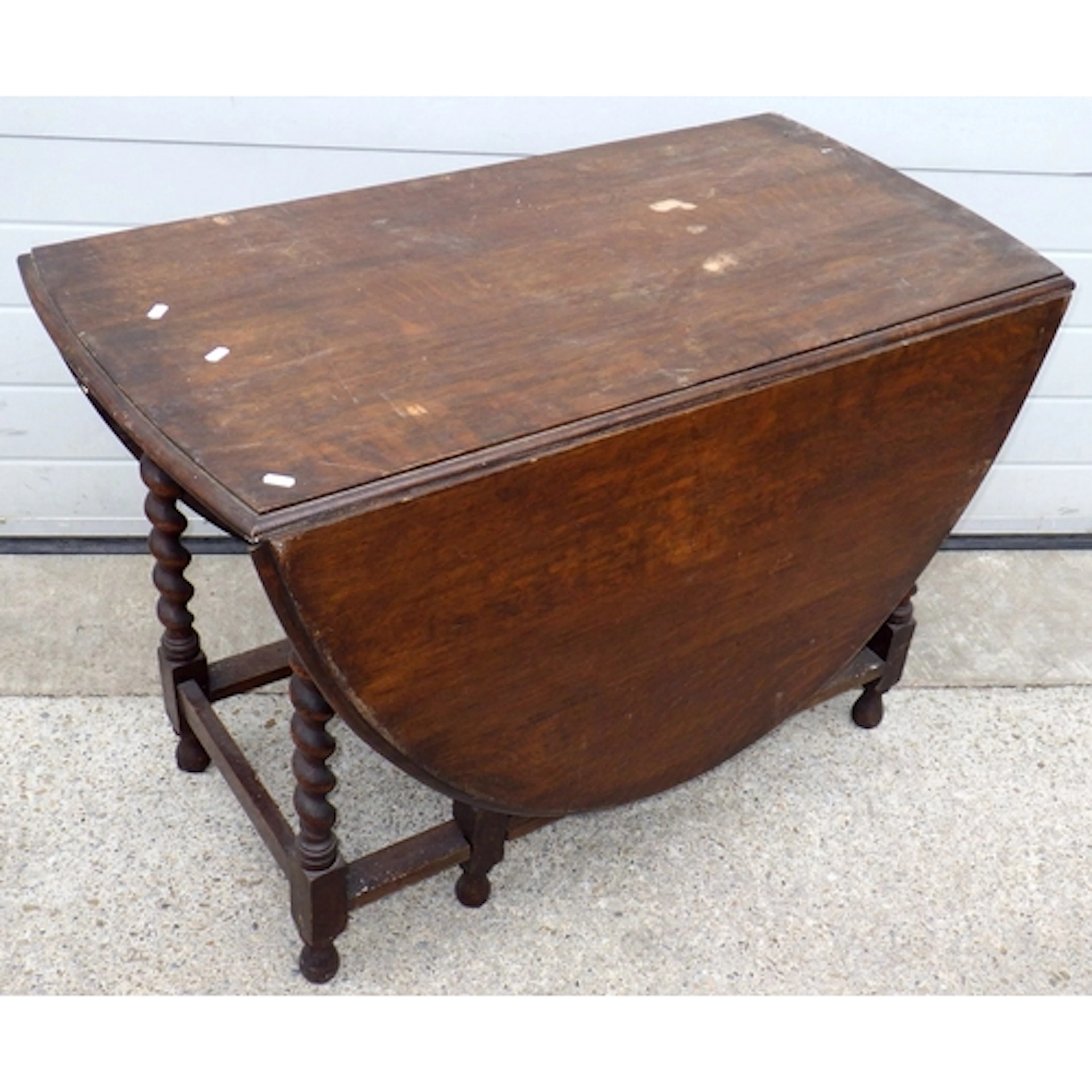 A 1930's barleytwist oak gateleg table, marks