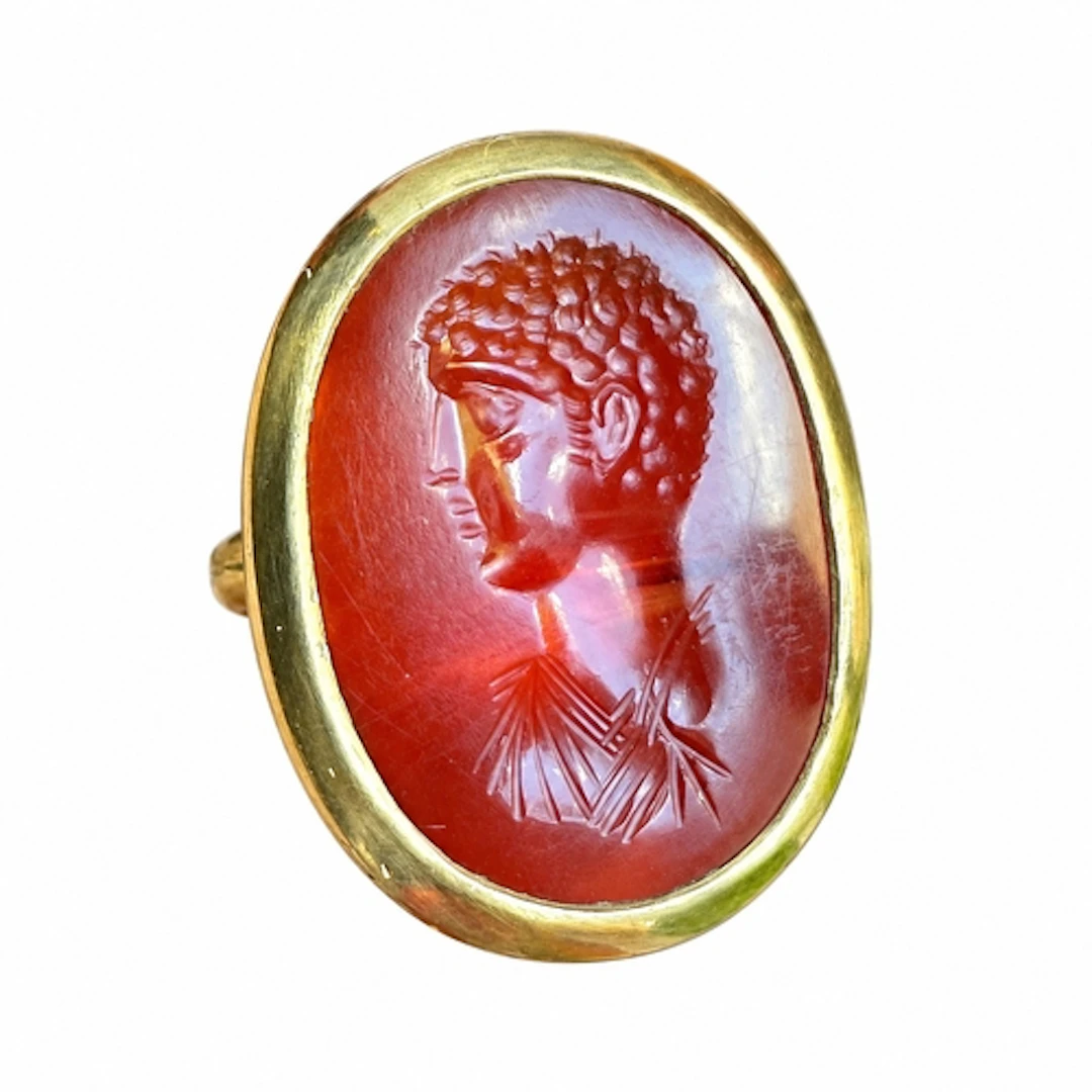 A high-carat gold ring set with an ancient Roman carnelian i...