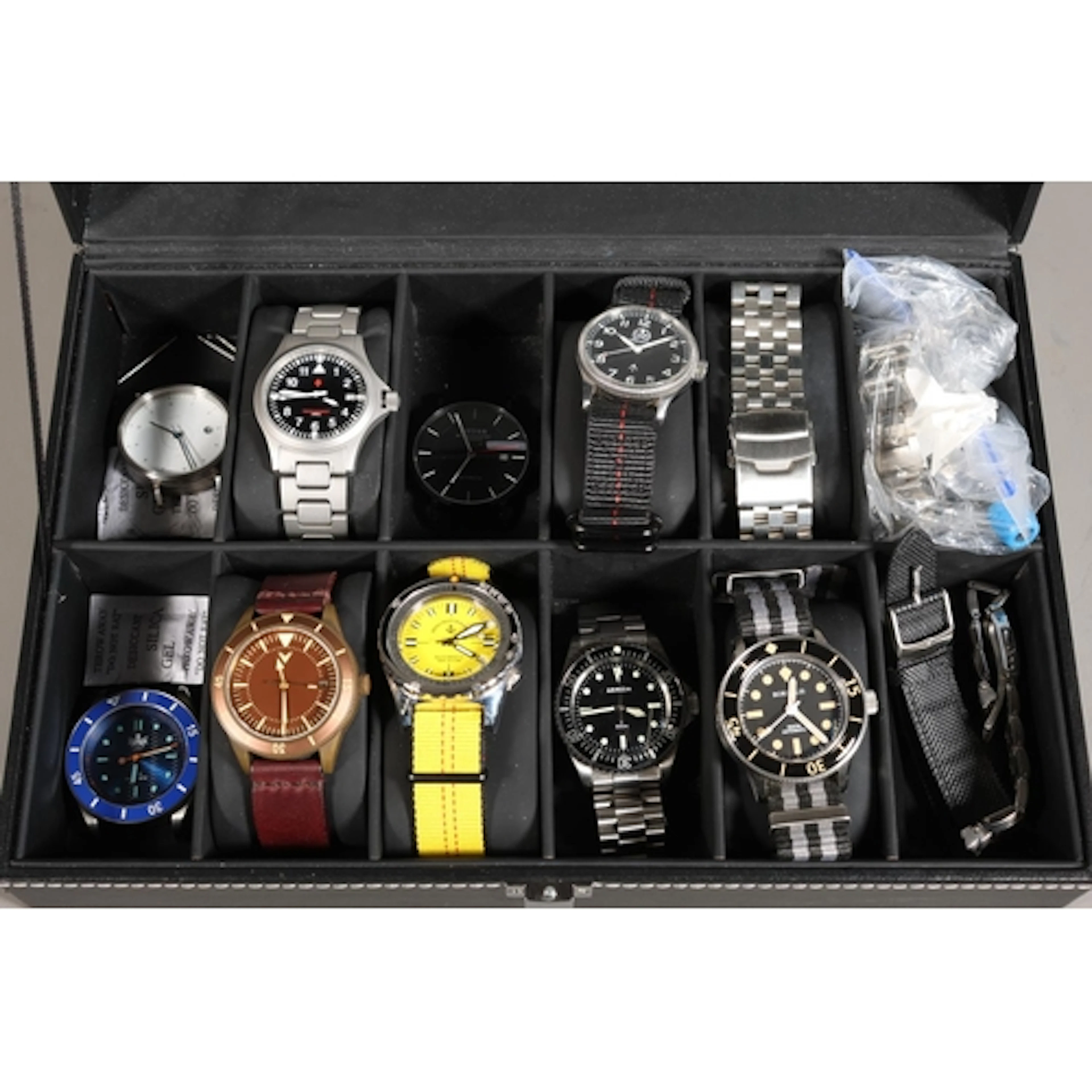 Watch case containing nine gents fashion watches to include ...
