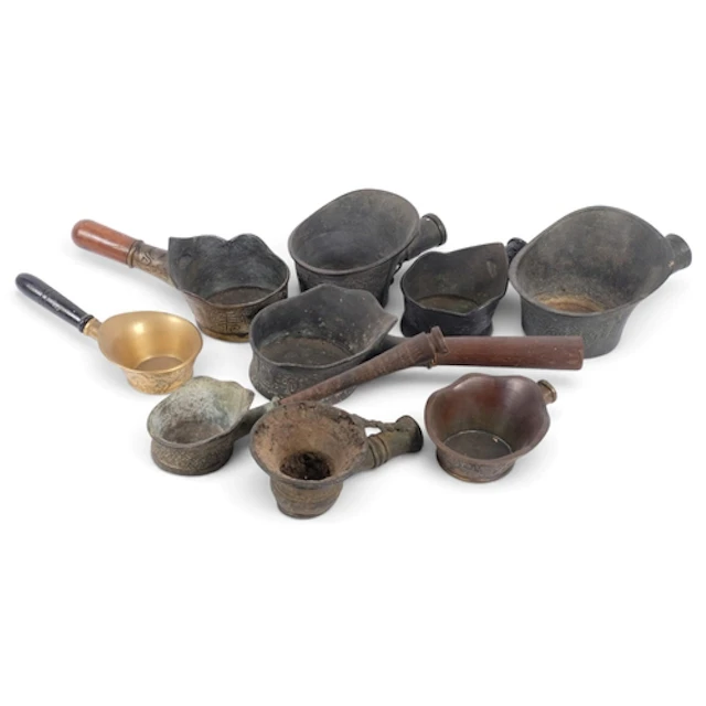A group of Chinese bronze silk irons